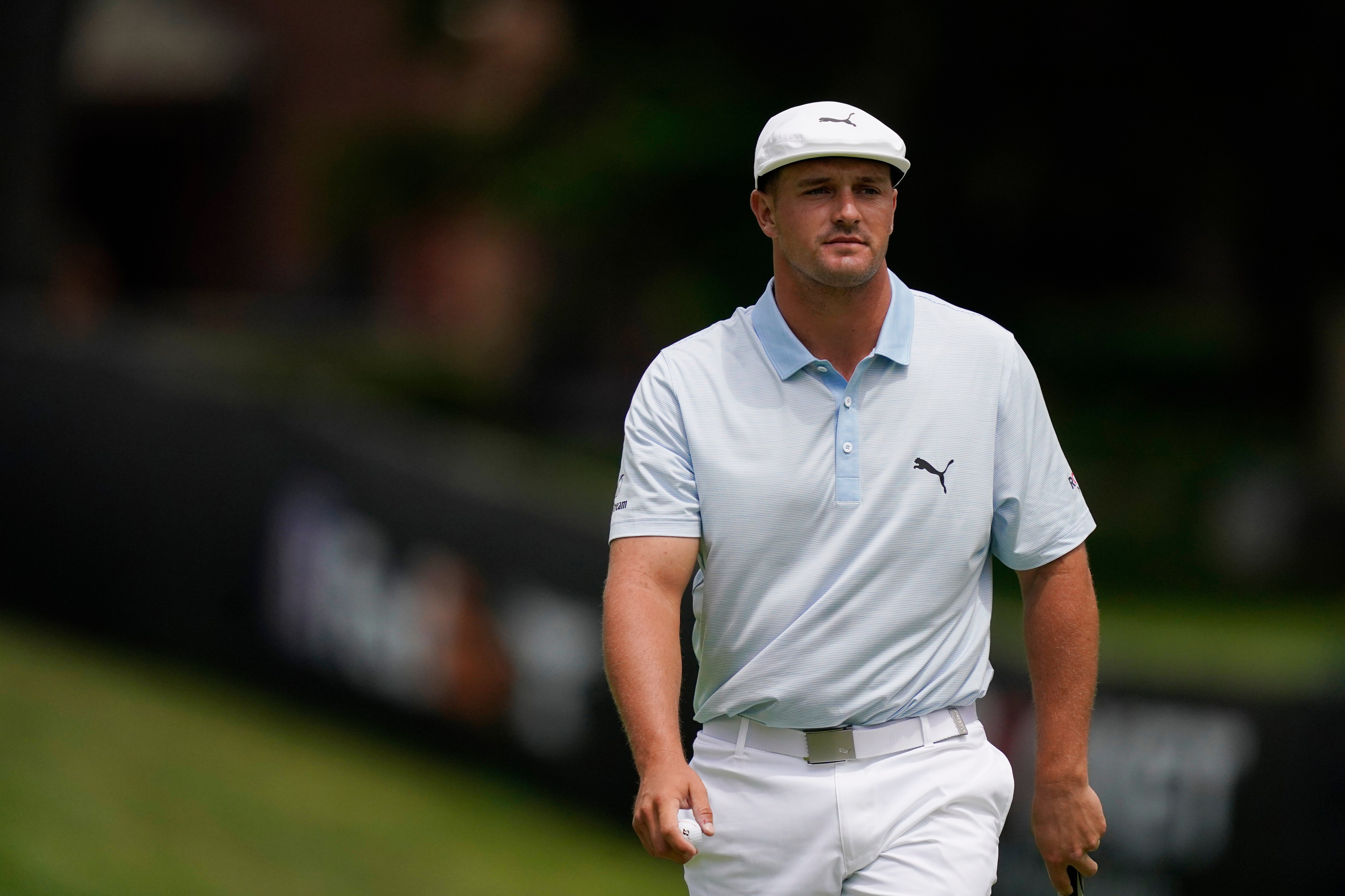 Bryson DeChambeau walks off the ninth green during the second round of the Rocket Mortgage Classic golf tournament, Friday, July 2, 2021, at the Detroit Golf Club in Detroit. (AP Photo/Carlos Osorio)