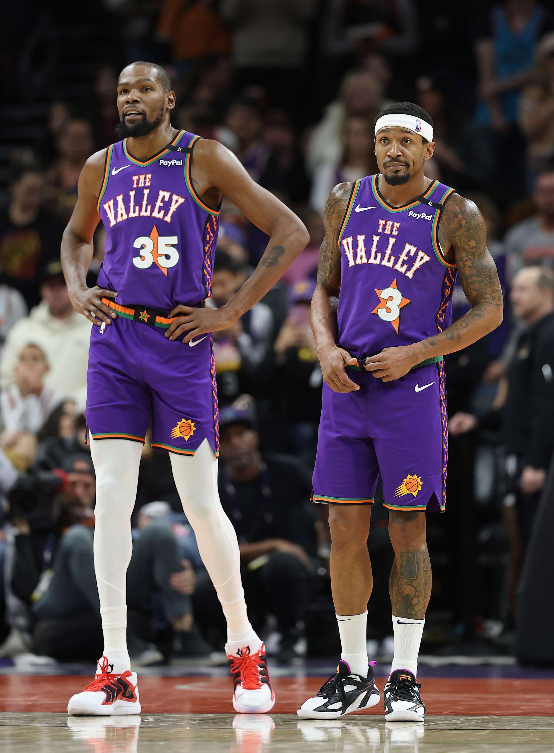 PHOENIX, ARIZONA - JANUARY 12: Kevin Durant #35 and Bradley Beal #3 of the Phoenix Suns during the second half of the NBA game at Footprint Center on January 12, 2025 in Phoenix, Arizona. The Suns defeated the Hornets 120-113. NOTE TO USER: User expressly acknowledges and agrees that, by downloading and or using this photograph, User is consenting to the terms and conditions of the Getty Images License Agreement.  (Photo by Christian Petersen/Getty Images)