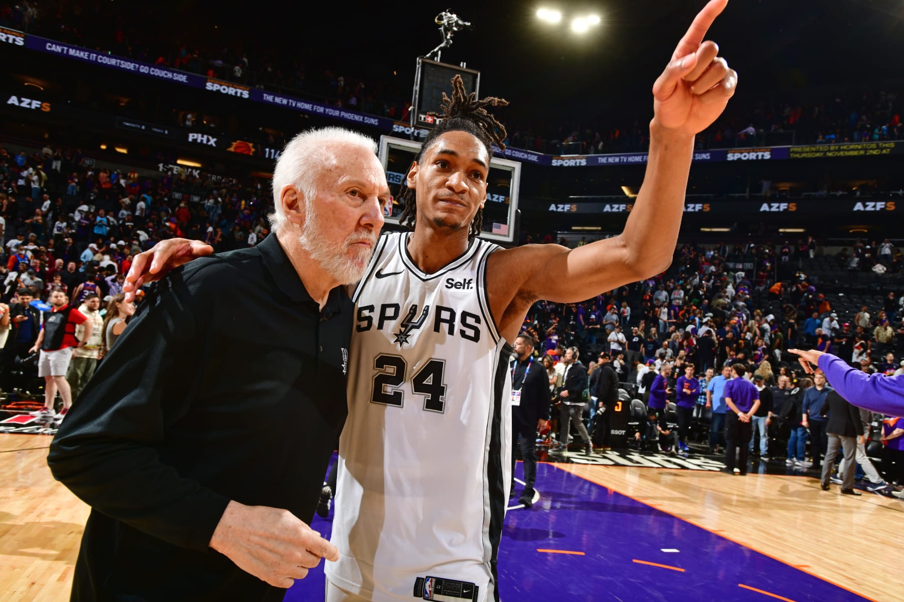 Gregg Popovich and Devin Vassell