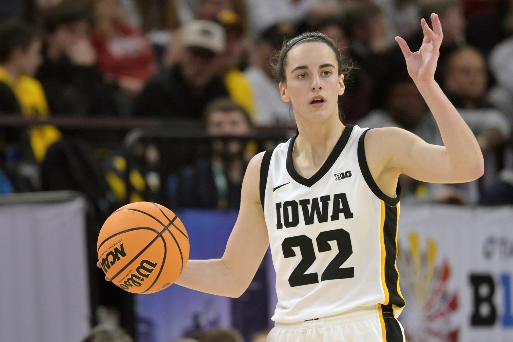 MINNEAPOLIS, MN - MARCH 09: Iowa Hawkeyes guard Caitlin Clark (22) calls a play as she brings the ball up-court during a Big Ten Women's Basketball Tournament semi final game between the Iowa Hawkeyes and Michigan Wolverines on March 9, 2024, at the the Target Center in Minneapolis, MN.(Photo by Nick Wosika/Icon Sportswire via Getty Images)