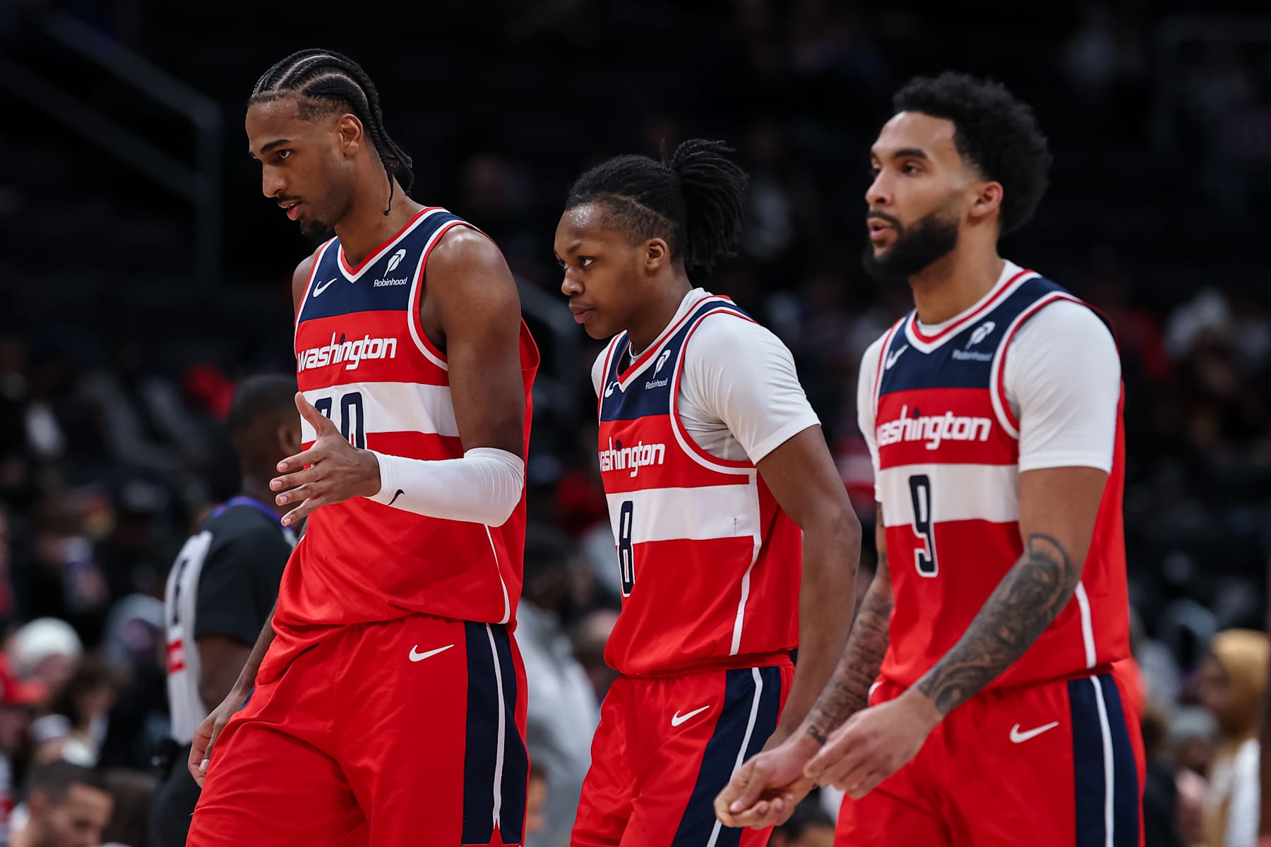 WASHINGTON, DC - JANUARY 05: Alexandre Sarr #20, Carlton Carrington #8, and Justin Champagnie #9 of the Washington Wizards look on during the second half against the New Orleans Pelicans at Capital One Arena on January 5, 2025 in Washington, DC. NOTE TO USER: User expressly acknowledges and agrees that, by downloading and or using this photograph, User is consenting to the terms and conditions of the Getty Images License Agreement. (Photo by Scott Taetsch/Getty Images)