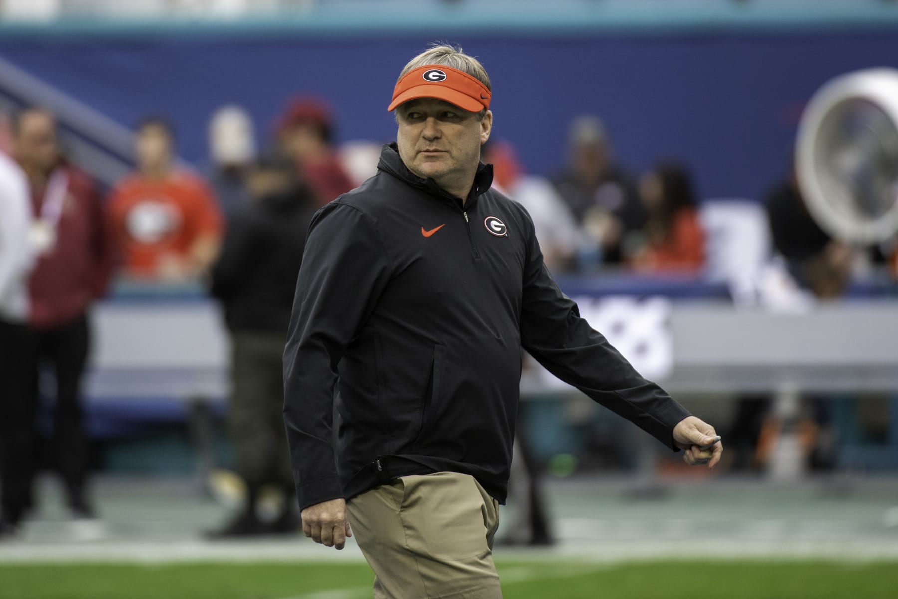 MIAMI GARDENS, FL - DECEMBER 30: Georgia head coach Kirby Smart watches the players warm up on the field before the Capital One Orange Bowl college football game between the Georgia Bulldogs and the Florida State Seminoles on December 30, 2023 at the Hard Rock Stadium in Miami Gardens, FL. (Photo by Doug Murray/Icon Sportswire via Getty Images)