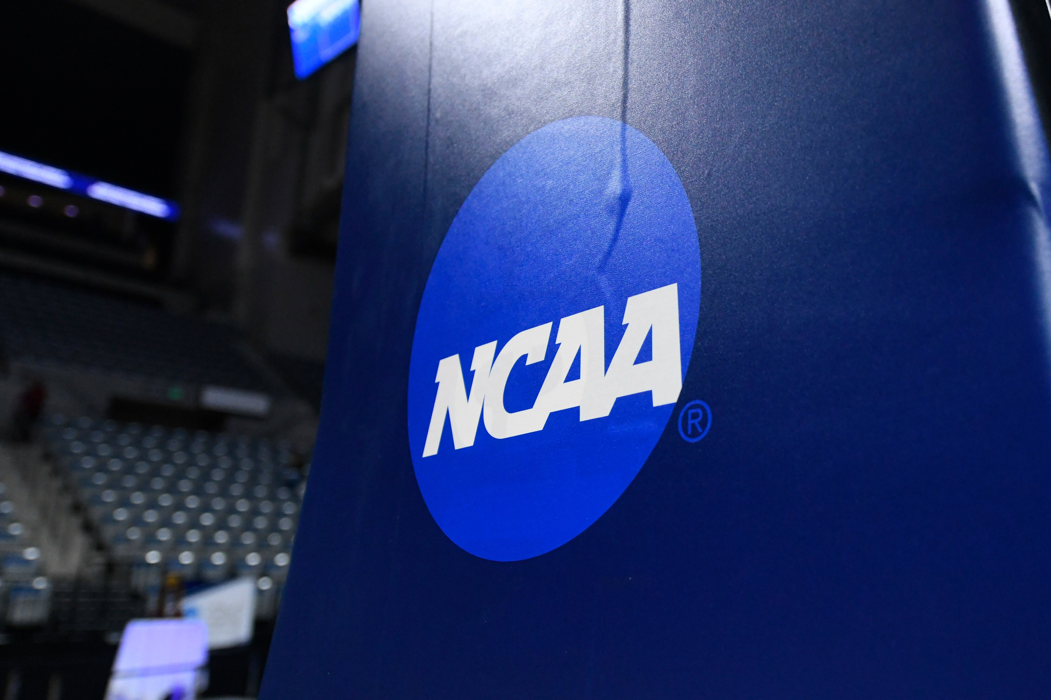FORT WAYNE, IN - MARCH 19: A NCAA logo is displayed on the goal post before the Division III National Championship basketball game between the Randolph-Macon Yellow Jackets and the Elmhurst Bluejays on March 19, 2022, at the Allen County War Memorial Coliseum in Fort Wayne, Indiana. (Photo by Michael Allio/Icon Sportswire via Getty Images) FORT WAYNE, IN - MARCH 19: A NCAA logo is displayed on the goal post before the Division III National Championship basketball game between the Randolph-Macon Yellow Jackets and the Elmhurst Bluejays on March 19, 2022, at the Allen County War Memorial Coliseum in Fort Wayne, Indiana. (Photo by Michael Allio/Icon Sportswire via Getty Images)