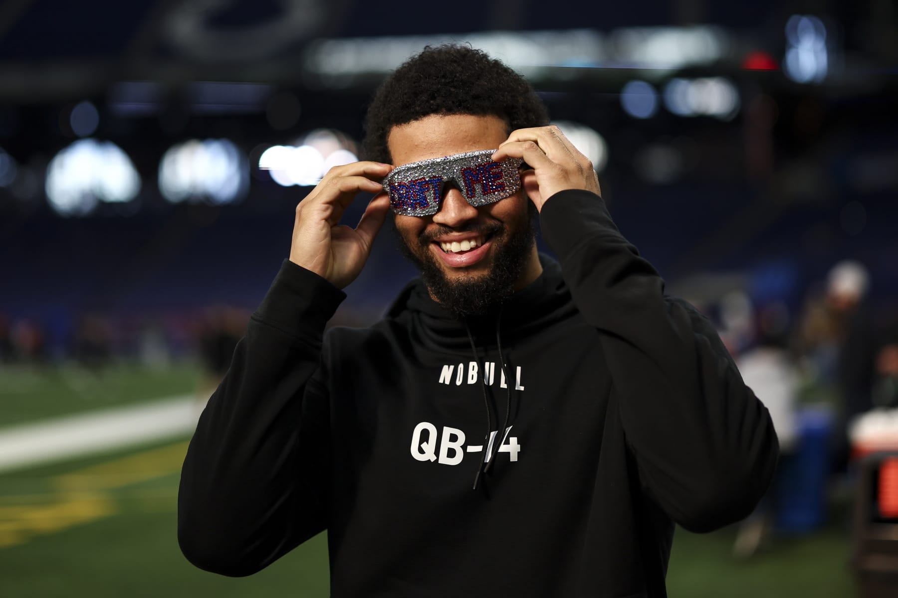 INDIANAPOLIS, INDIANA - MARCH 2: Caleb Williams #QB14 of Southern California smiles while wearing "Draft Me" sunglasses during the NFL Combine at the Indiana Convention Center on March 2, 2024 in Indianapolis, Indiana. (Photo by Kevin Sabitus/Getty Images)