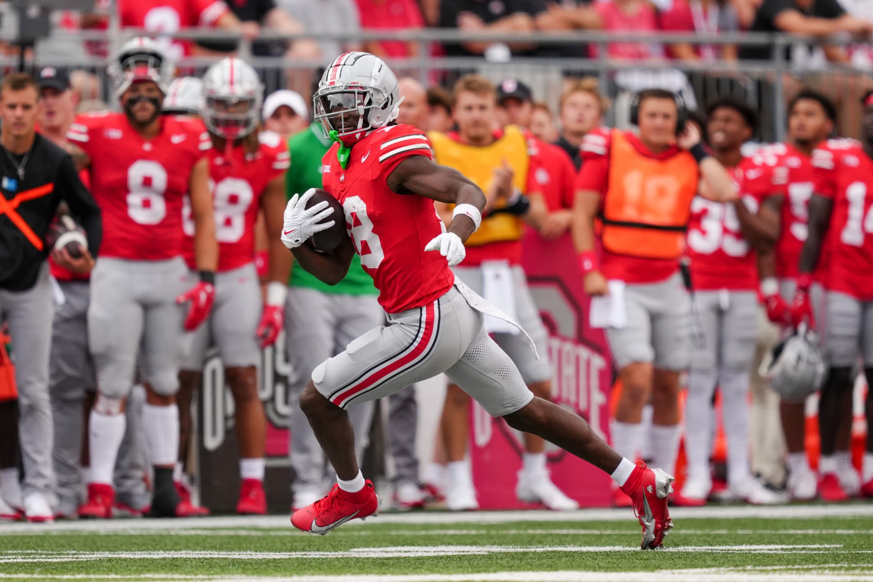 COLUMBUS, OHIO - SEPTEMBER 16: Marvin Harrison Jr. #18 of the Ohio State Buckeyes runs with the ball in the second quarter against the Western Kentucky Hilltoppers at Ohio Stadium on September 16, 2023 in Columbus, Ohio. (Photo by Dylan Buell/Getty Images)