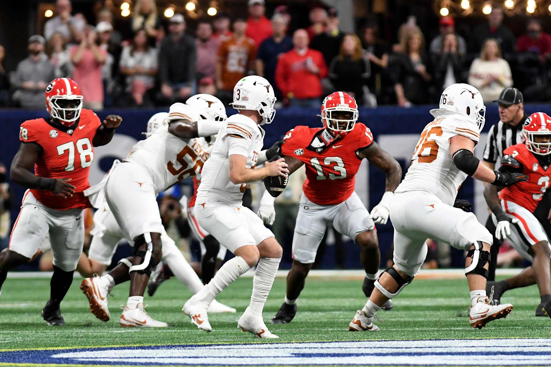 ATLANTA, GA - DECEMBER 7: Mykel Williams #13 of the Georgia Bulldogs pressures Quinn Ewers #3 of the Texas Longhorns during a game between University of Texas and University of Georgia at Mercedes-Benz Stadium on December 7, 2024 in Atlanta, Georgia. (Photo by Perry McIntyre/ISI Photos/Getty Images)
