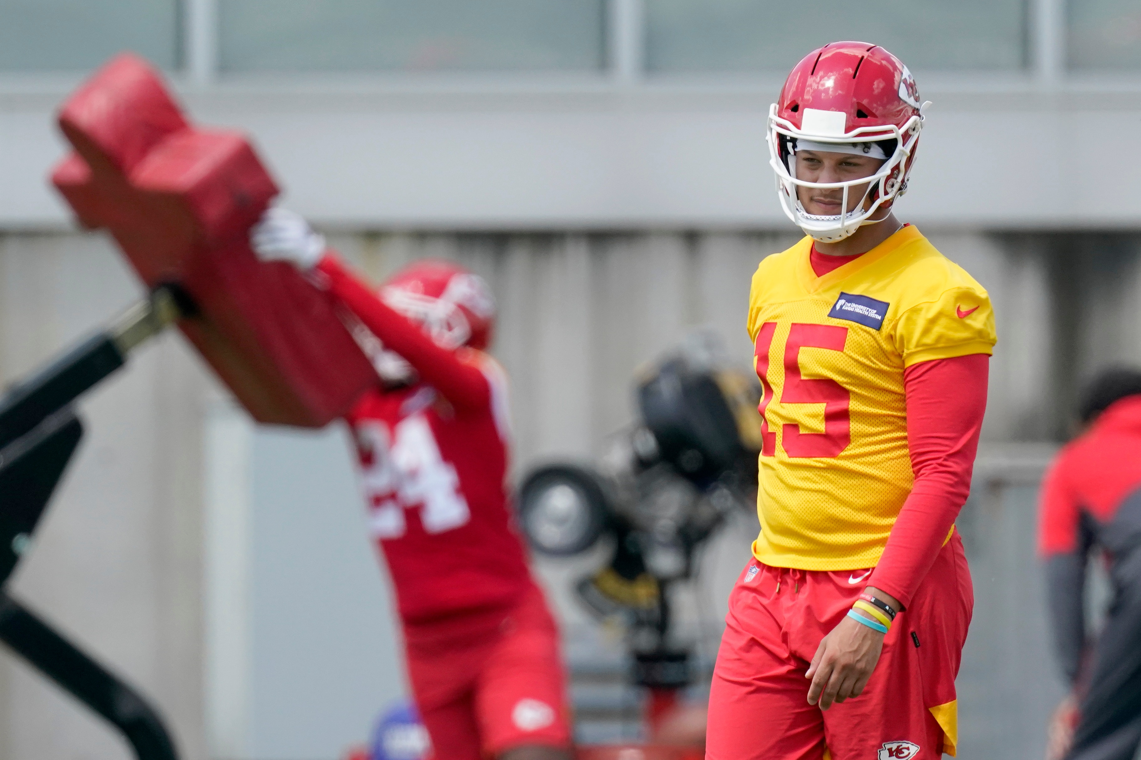 Kansas City Chiefs quarterback Patrick Mahomes waits to start a drill during the NFL football team's organized team activities Thursday, June 10, 2021, in Kansas City, Mo. (AP Photo/Charlie Riedel)