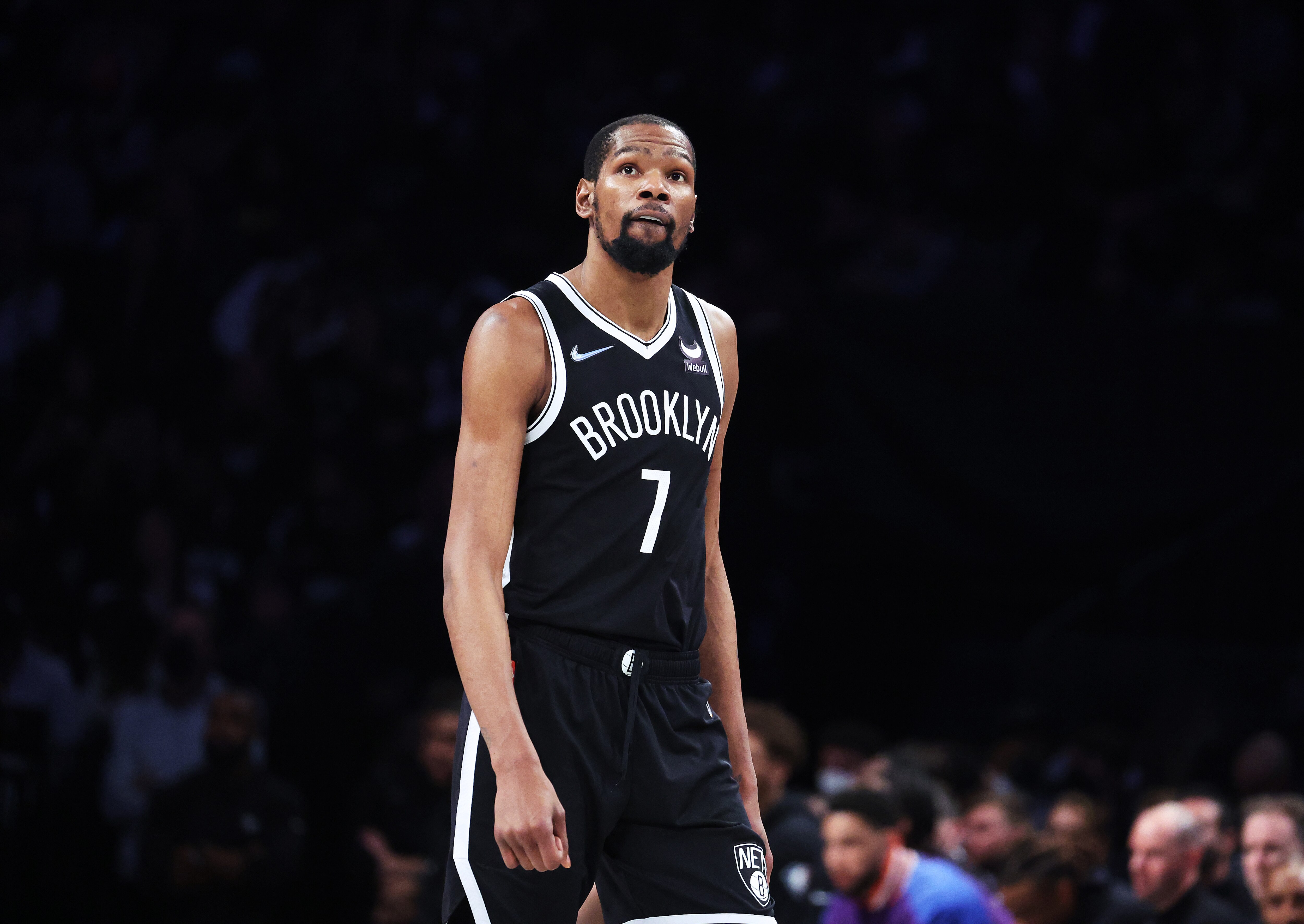 NEW YORK, NEW YORK - APRIL 23:  Kevin Durant #7 of the Brooklyn Nets looks on against the Boston Celtics during Game Three of the Eastern Conference First Round NBA Playoffs at Barclays Center on April 23, 2022 in New York City.  NOTE TO USER: User expressly acknowledges and agrees that, by downloading and or using this photograph, User is consenting to the terms and conditions of the Getty Images License Agreement.  (Photo by Al Bello/Getty Images).