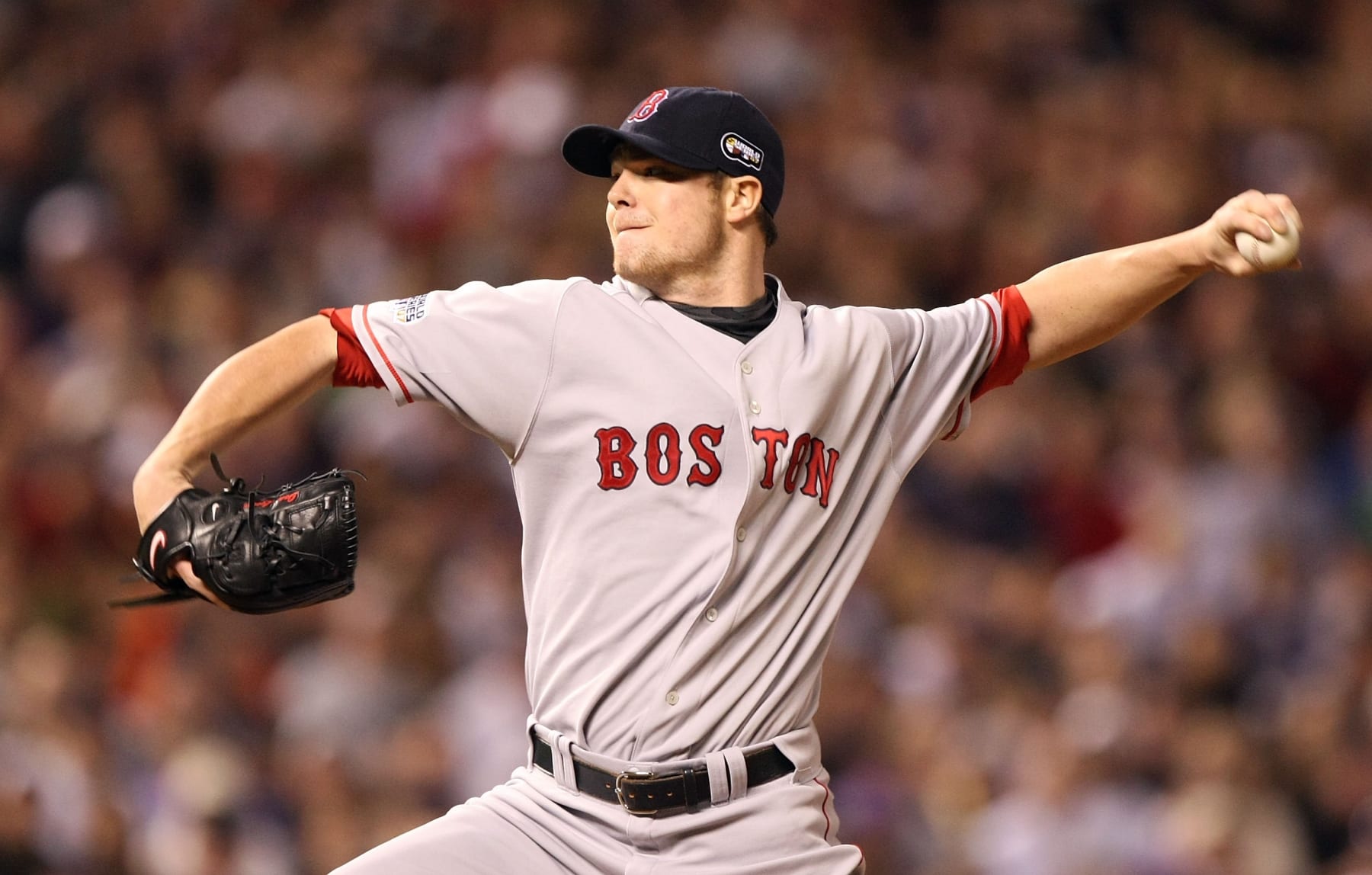 DENVER - OCTOBER 28:  Starting pitcher Jon Lester #31 of the Boston Red Sox deals during Game Four of the 2007 Major League Baseball World Series against the Colorado Rockies at Coors Field on October 28, 2007 in Denver, Colorado.  (Photo by Jed Jacobsohn/Getty Images)