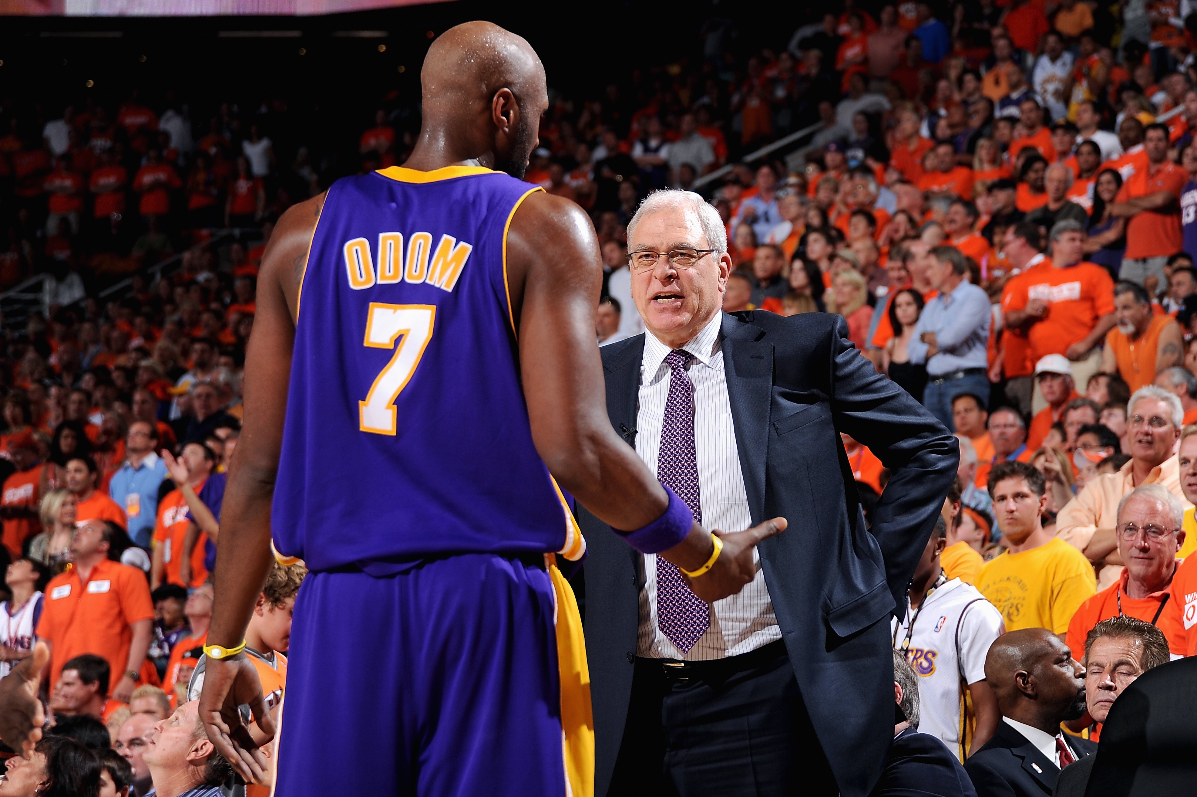 PHOENIX - MAY 23:  Lamar Odom #7 talks to head coach Phil Jackson of the Los Angeles Lakers in Game Three of the Western Conference Finals against the Phoenix Suns  during the 2010 NBA Playoffs on May 23, 2010 at US Airways Center in Phoenix, Arizona.  The Suns won 118-109.  NOTE TO USER: User expressly acknowledges and agrees that, by downloading and/or using this Photograph, user is consenting to the terms and conditions of the Getty Images License Agreement. Mandatory Copyright Notice: Copyright 2010 NBAE   (Photo by Andrew D. Bernstein/NBAE via Getty Images)