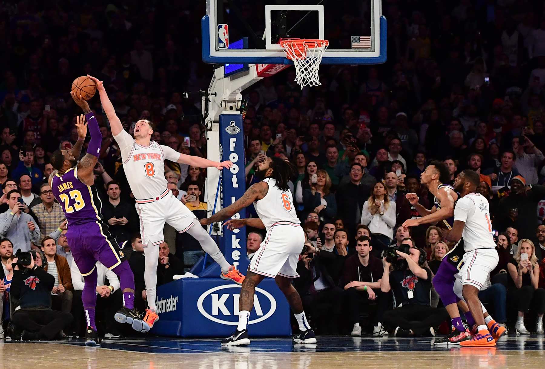 NEW YORK, NEW YORK - MARCH 17: Mario Hezonja #8 of the New York Knicks blocks a shot from LeBron James #23 of the Los Angeles Lakers during the last seconds of the fourth quarter during the game at Madison Square Garden on March 17, 2019 in New York City. NOTE TO USER: User expressly acknowledges and agrees that, by downloading and or using this photograph, User is consenting to the terms and conditions of the Getty Images License Agreement. (Photo by Sarah Stier/Getty Images)