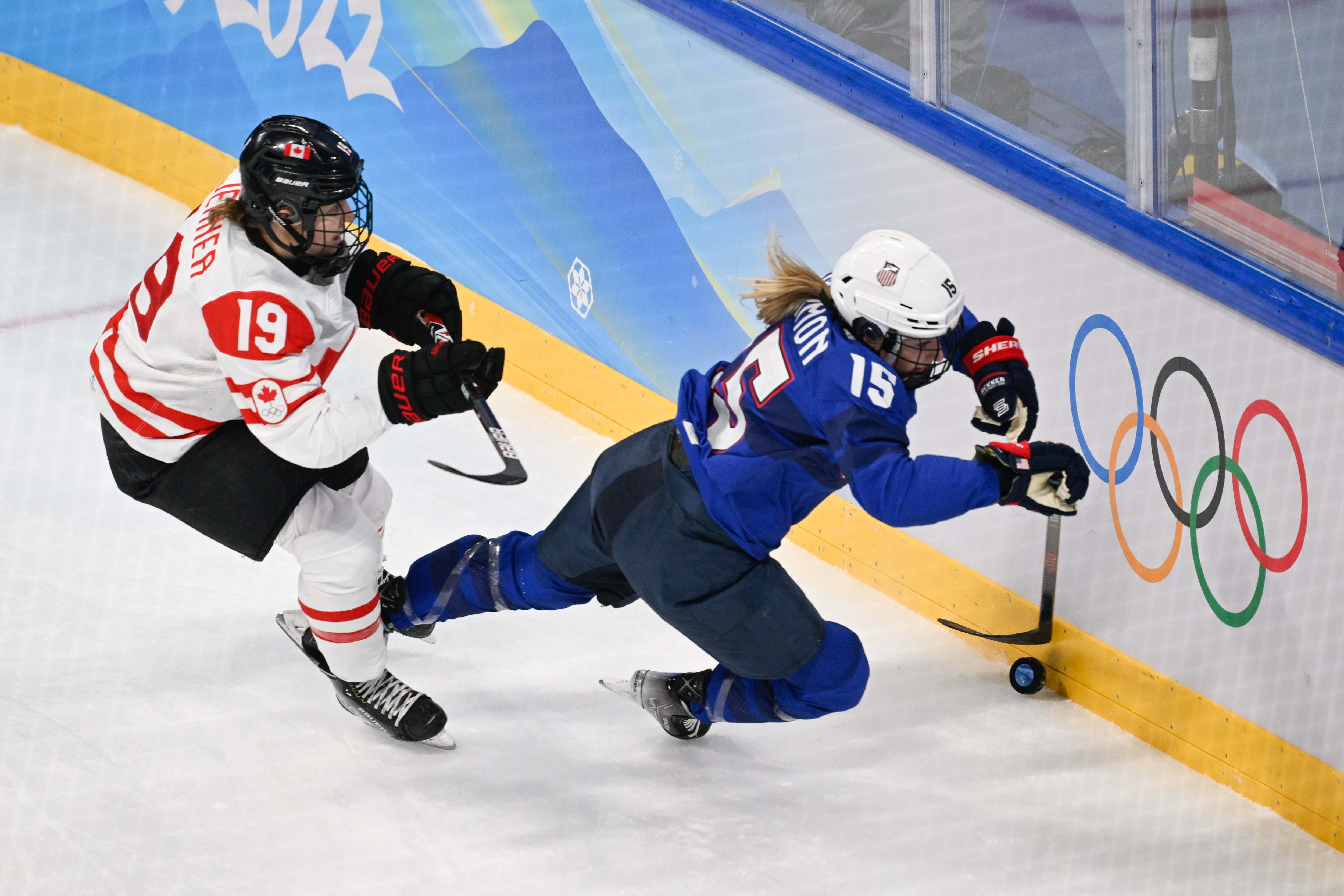 BEIJING, CHINA - FEBRUARY 08: Brianne Jenner of Canada and Savannah Harmon of USA battle for the puck in the match between USA and Canada during the Beijing 2022 Winter Olympics at National Indoor Stadium on February 8, 2022 in Beijing, China. (Photo by Mario Hommes/DeFodi Images via Getty Images)