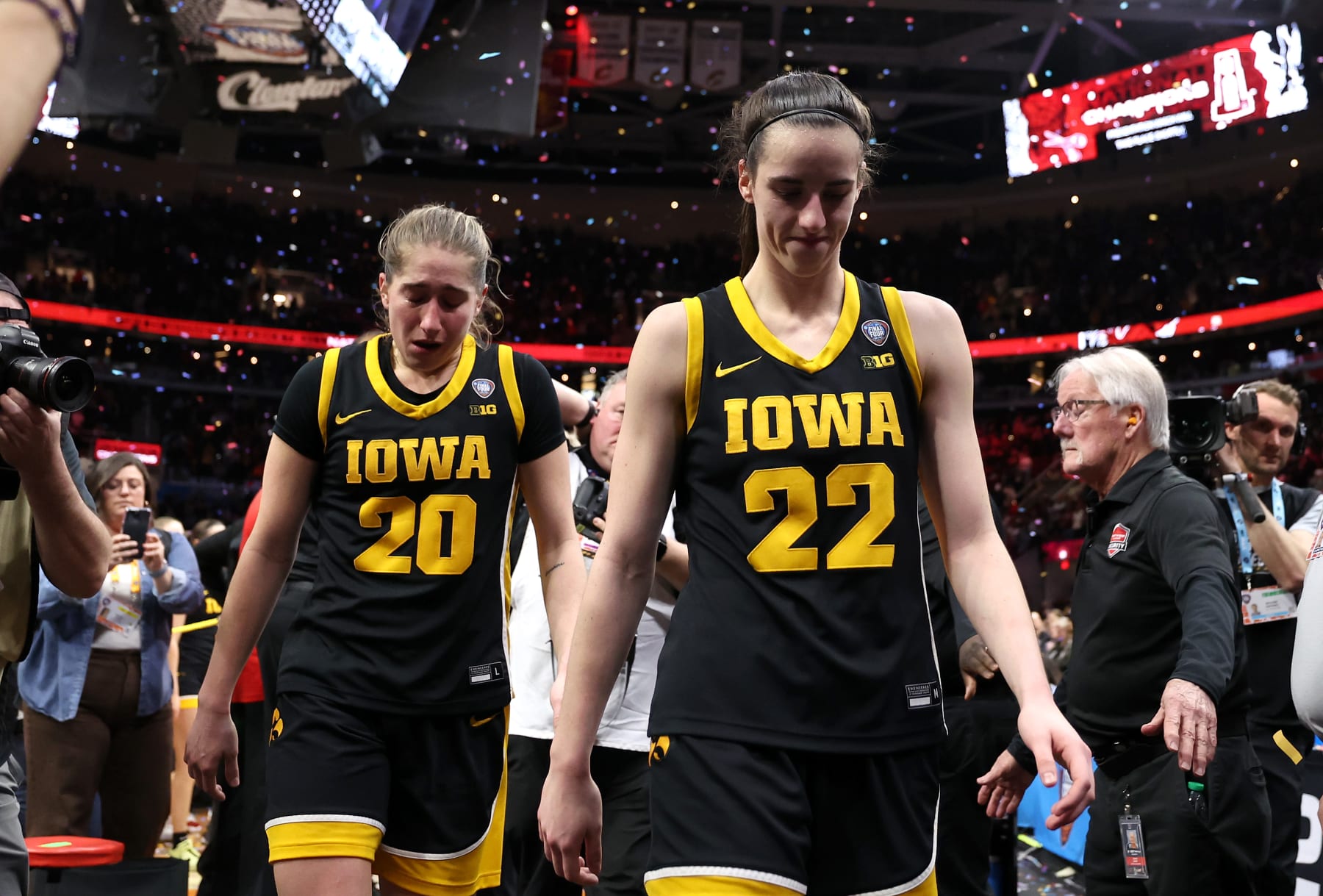 CLEVELAND, OHIO - APRIL 07: Caitlin Clark #22 and Kate Martin #20 of the Iowa Hawkeyes walk off the court after losing to the South Carolina Gamecocks in the 2024 NCAA Women's Basketball Tournament National Championship at Rocket Mortgage FieldHouse on April 07, 2024 in Cleveland, Ohio. Iowa beat South Carolina 87-75. (Photo by Steph Chambers/Getty Images)