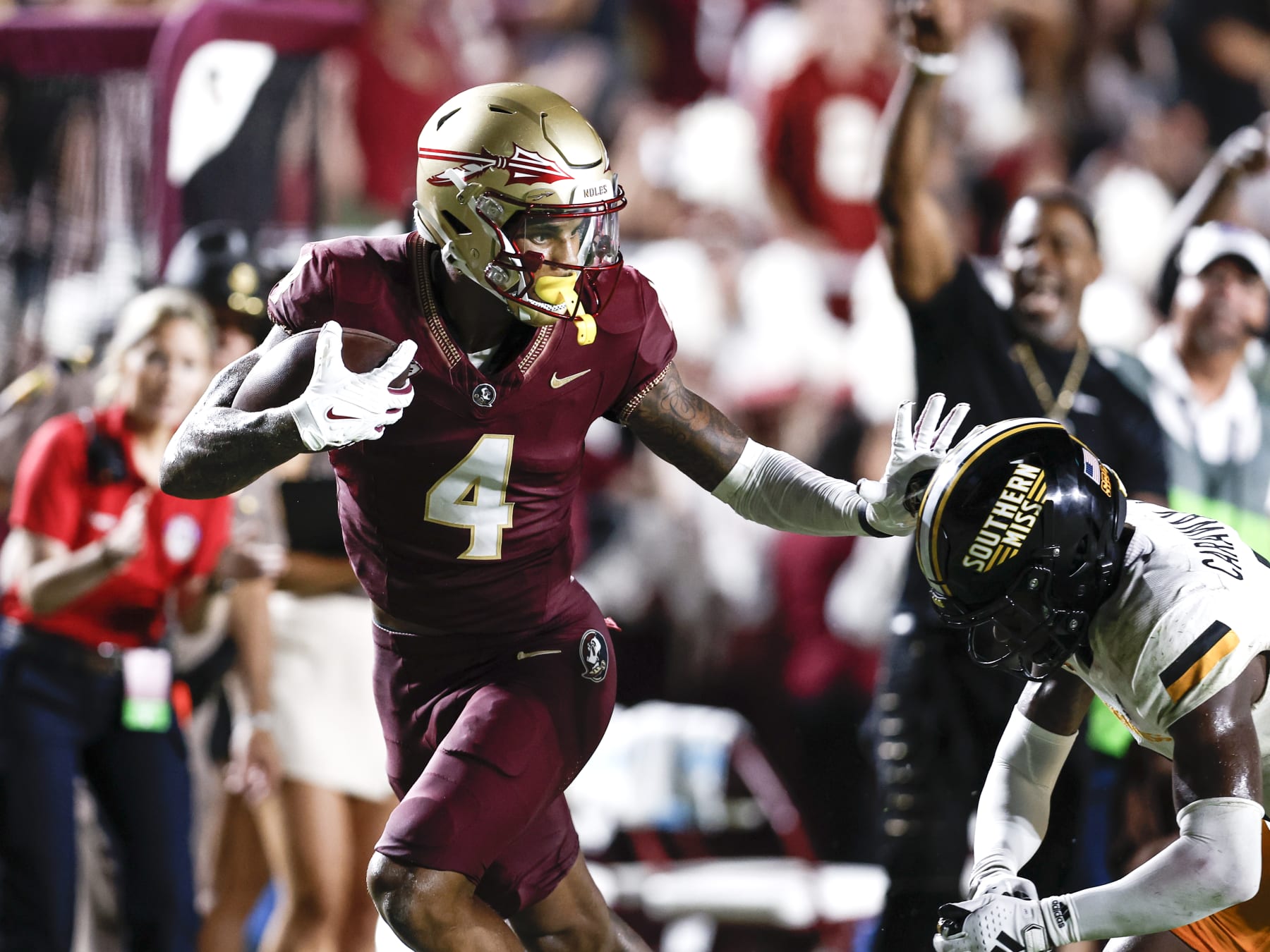 TALLAHASSEE, FL - SEPTEMBER 9: Wide Receiver Keon Coleman #4 of the Florida State Seminoles gives a stiff arm to Cornerback Micheal Caraway, Jr. #2 of the Southern Miss Golden Eagles during the game at Doak Campbell Stadium on Bobby Bowden Field on September 9, 2023 in Tallahassee, Florida. The Seminoles defeated the Golden Eagles 66 to 13. (Photo by Don Juan Moore/Getty Images)