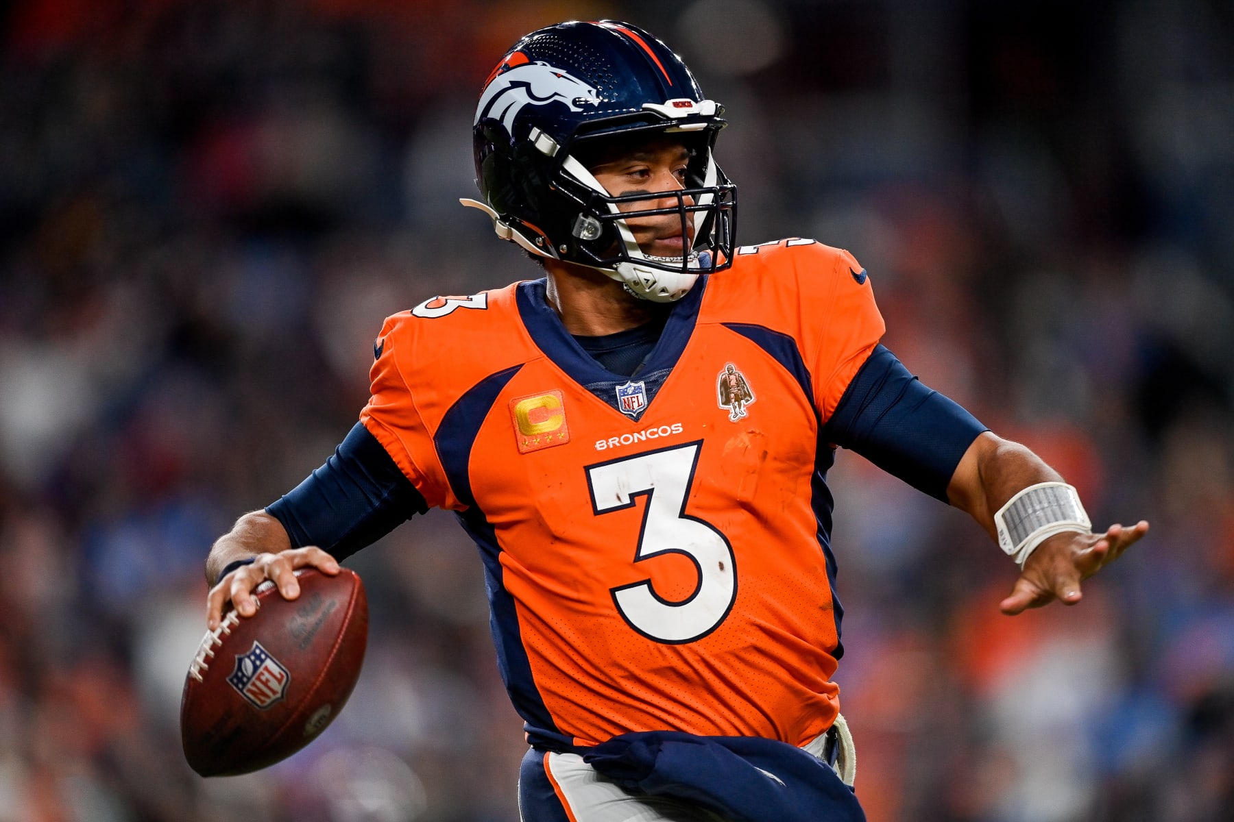 DENVER, CO - JANUARY 8: Denver Broncos quarterback Russell Wilson (3) looks downfield in the fourth quarter during a game between the Los Angeles Chargers and the Denver Broncos at Empower Field at Mile High on January 8, 2023 in Denver, Colorado. (Photo by Dustin Bradford/Icon Sportswire via Getty Images)
