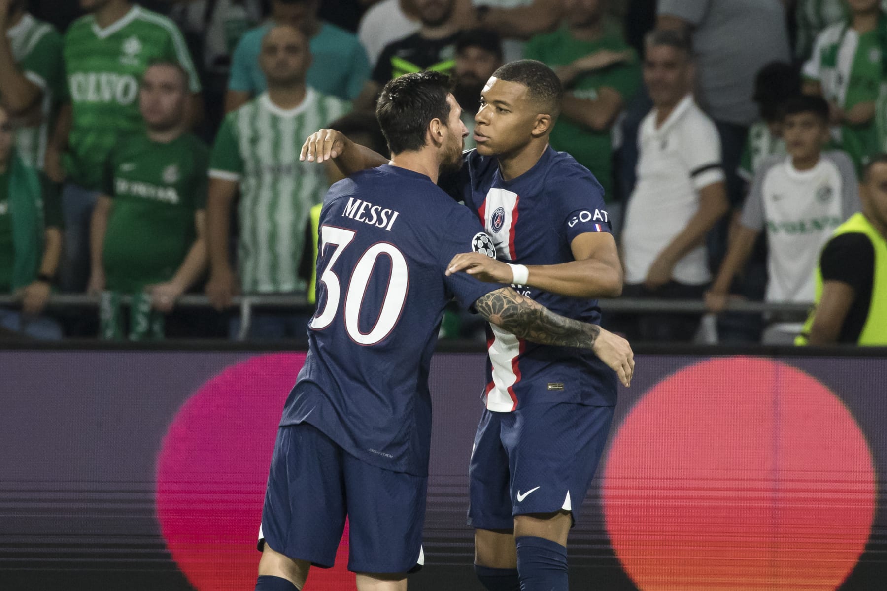 HAIFA, ISRAEL - SEPTEMBER 14: Kylian Mbappé of Paris Saint-Germain celebrates with Lionel Messi after socirng his team's third goal during the UEFA Champions League group H match between Maccabi Haifa FC and Paris Saint-Germain at Sammy Ofer Stadium on September 14, 2022 in Haifa, Israel.  (Photo by Amir Levy/Getty Images)