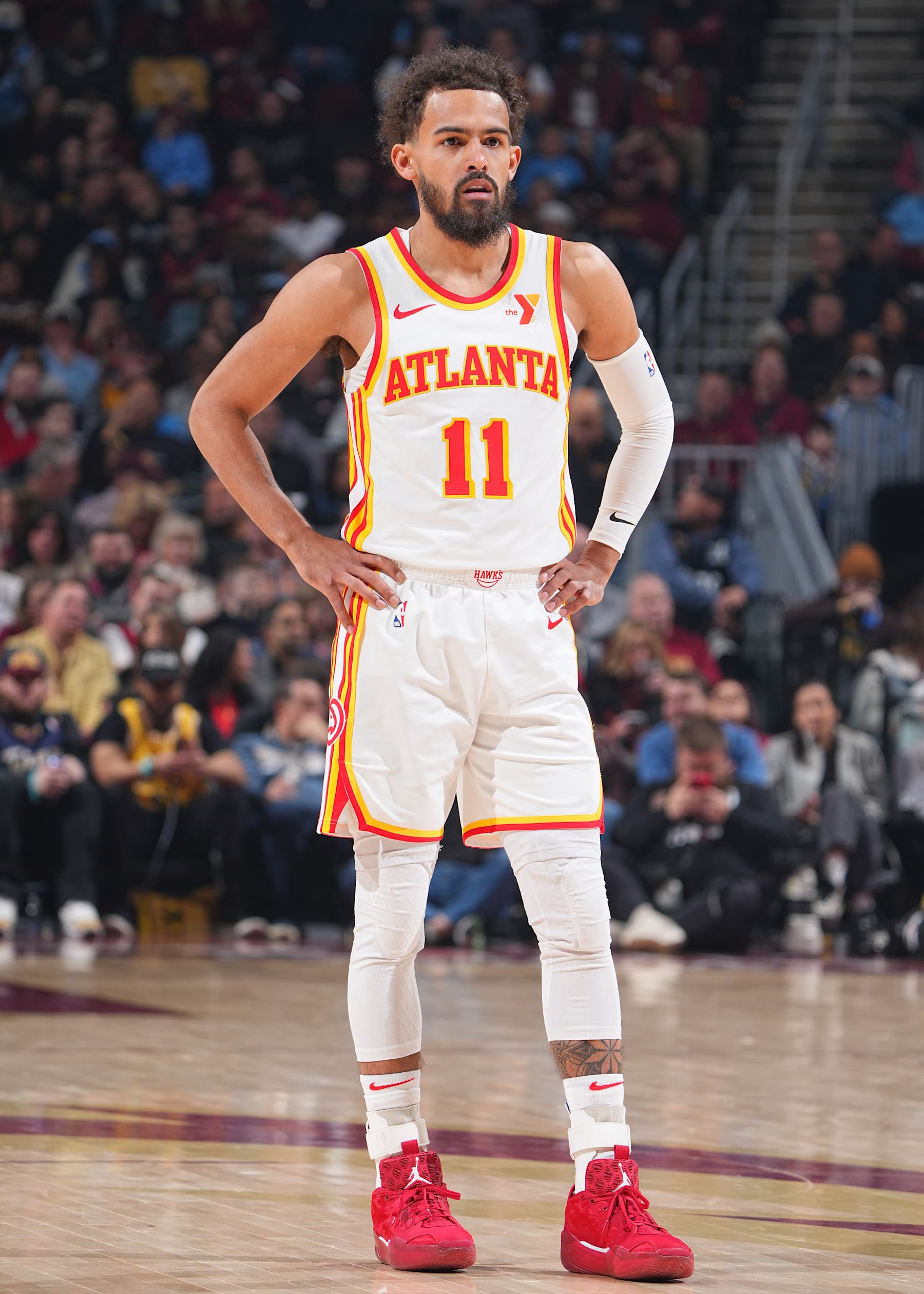 CLEVELAND, OH - JANUARY 30:  Trae Young #11 of the Atlanta Hawks looks on during the game against the Cleveland Cavaliers on January 30, 2025 at Rocket Mortgage FieldHouse in Cleveland, Ohio. NOTE TO USER: User expressly acknowledges and agrees that, by downloading and/or using this Photograph, user is consenting to the terms and conditions of the Getty Images License Agreement. Mandatory Copyright Notice: Copyright 2025 NBAE (Photo by Garrett Ellwood/NBAE via Getty Images)