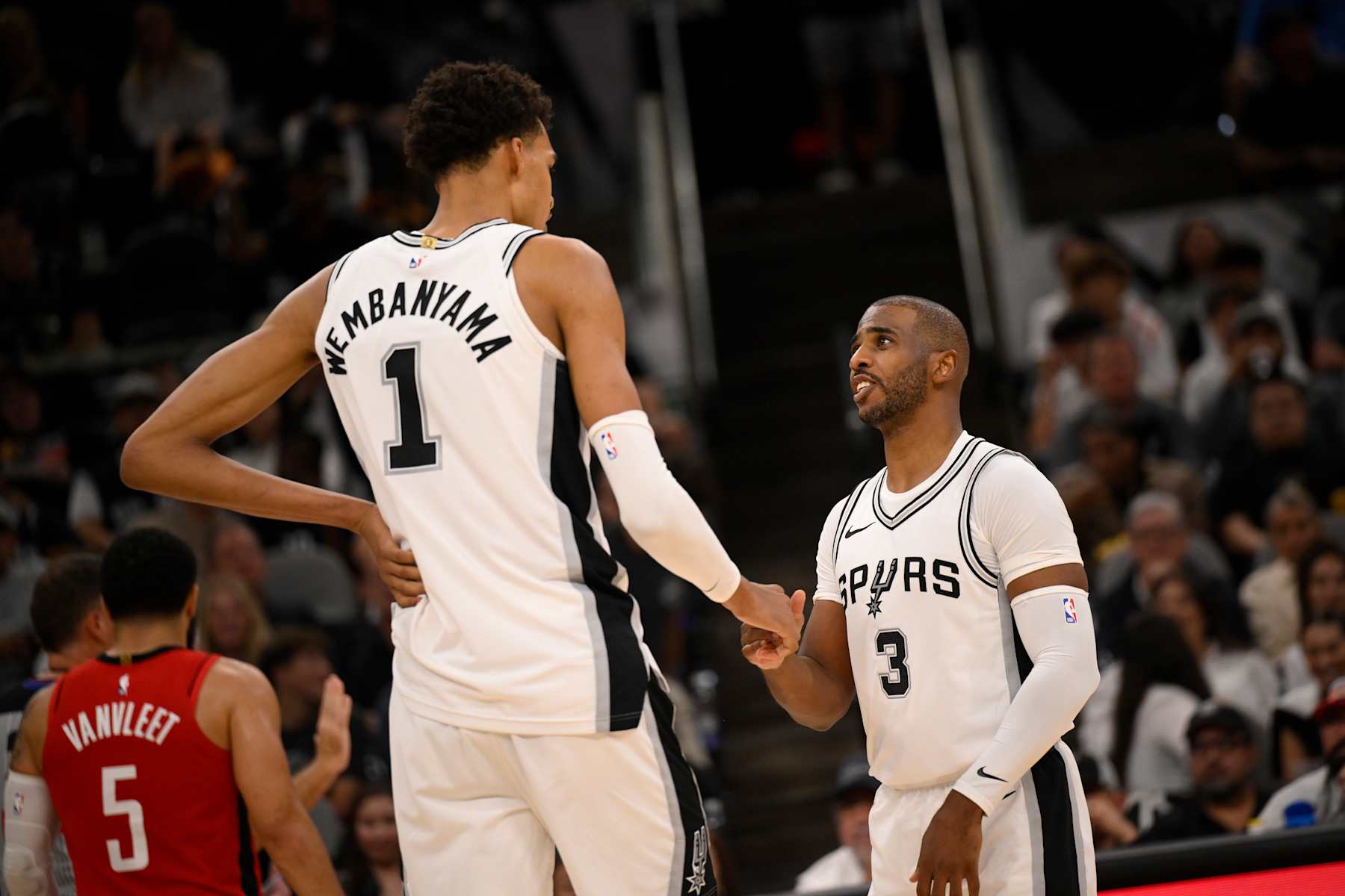 SAN ANTONIO, TX - OCTOBER 26: Victor Wembanyama #1 and Chris Paul #3 of the San Antonio Spurs high five during the game against the Houston Rockets on October 26, 2024 at the Frost Bank Center in San Antonio, Texas. NOTE TO USER: User expressly acknowledges and agrees that, by downloading and or using this photograph, user is consenting to the terms and conditions of the Getty Images License Agreement. Mandatory Copyright Notice: Copyright 2024 NBAE (Photos by David Dow/NBAE via Getty Images)