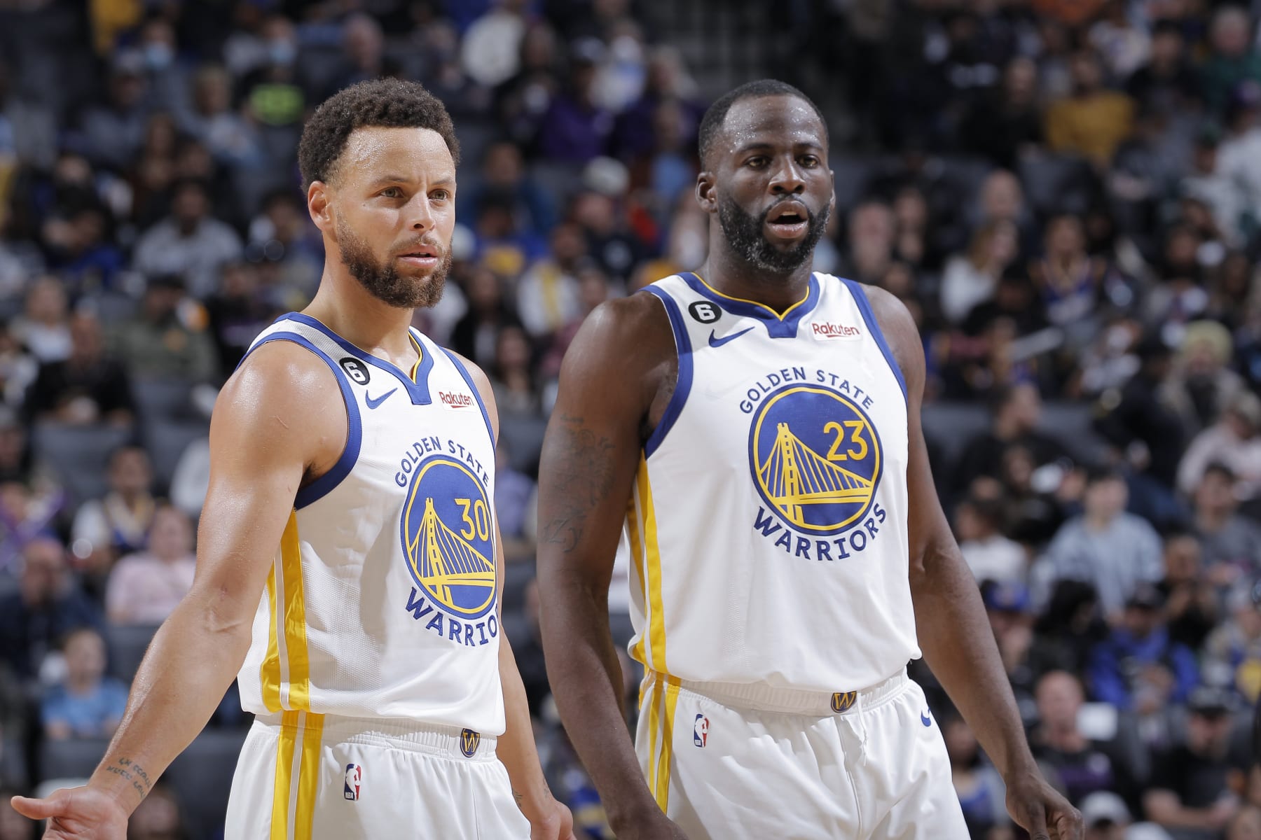 SACRAMENTO, CA - NOVEMBER 13: Stephen Curry #30 and Draymond Green #23 of the Golden State Warriors look on during the game against the the Sacramento Kings on November 13, 2022 at Golden 1 Center in Sacramento, California. NOTE TO USER: User expressly acknowledges and agrees that, by downloading and or using this photograph, User is consenting to the terms and conditions of the Getty Images Agreement. Mandatory Copyright Notice: Copyright 2022 NBAE (Photo by Rocky Widner/NBAE via Getty Images)