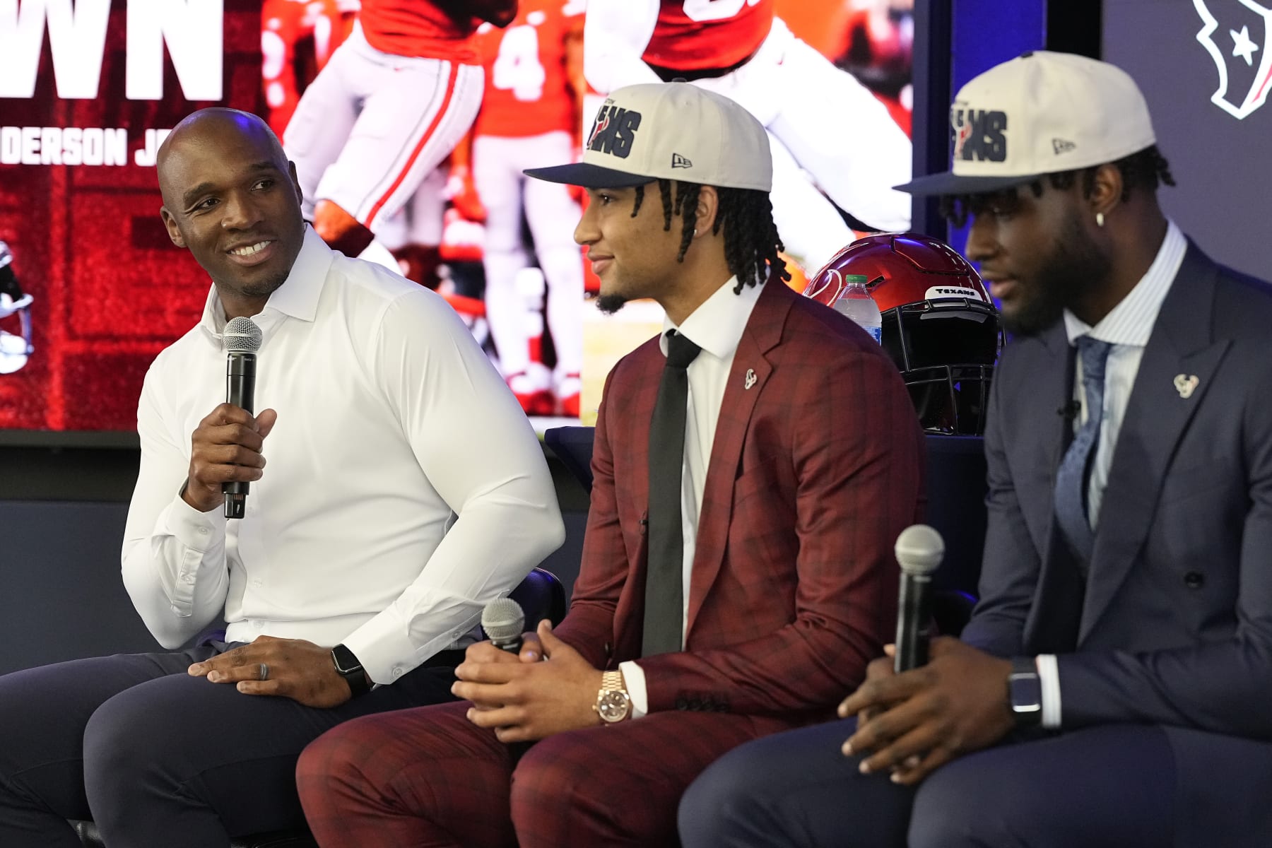 Houston Texans head coach DeMeco Ryans,left, talks about Texans' first round draft picks quarterback C.J. Stroud, center, and linebacker Will Anderson Jr. during an NFL football press conference, Friday, April 28, 2023, in Houston. (AP Photo/Kevin M. Cox)