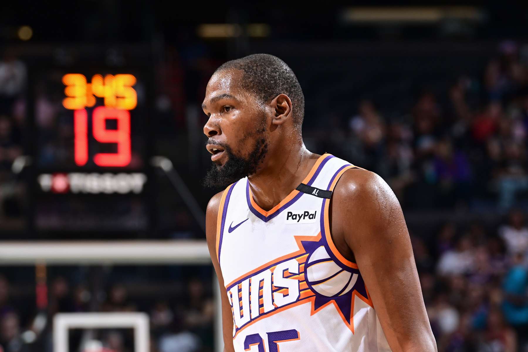 PHOENIX, AZ - OCTOBER 11: Kevin Durant #35 of the Phoenix Suns looks on during the game on October 11, 2024 at Footprint Center in Phoenix, Arizona. NOTE TO USER: User expressly acknowledges and agrees that, by downloading and or using this photograph, user is consenting to the terms and conditions of the Getty Images License Agreement. Mandatory Copyright Notice: Copyright 2024 NBAE (Photo by Kate Frese/NBAE via Getty Images)