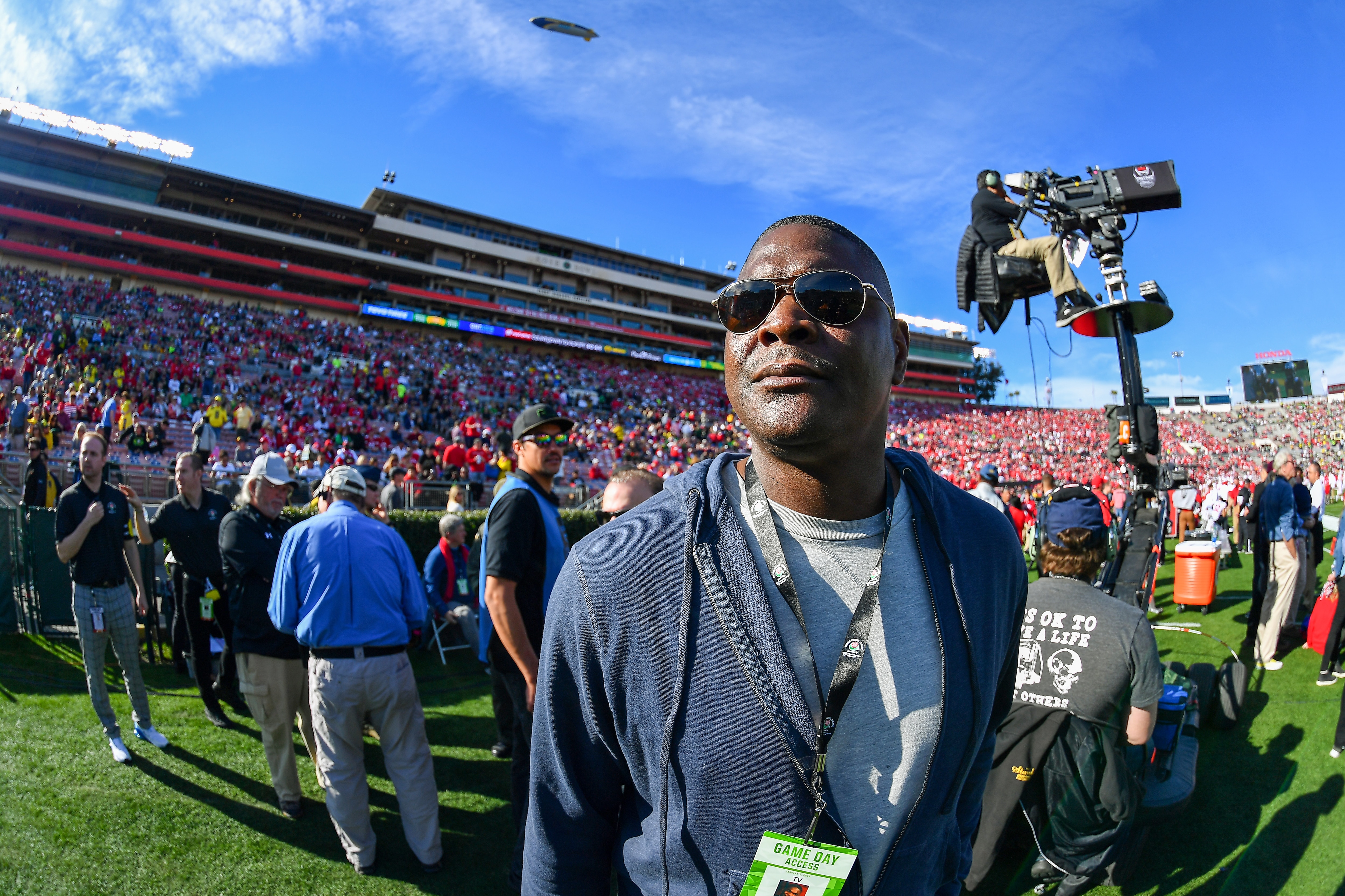 PASADENA, CALIFORNIA - JANUARY 01: Retired NFL and college football star, Keyshawn Johnson, walks the sidelines before the game between the Oregon Ducks and the Wisconsin Badgers at the Rose Bowl on January 01, 2020 in Pasadena, California. The Oregon Ducks topped the Wisconsin Badgers, 28-27. (Photo by Alika Jenner/Getty Images)