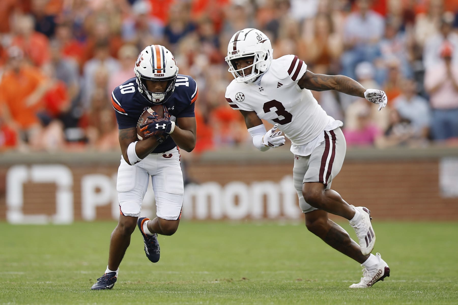 AUBURN, ALABAMA - OCTOBER 28: Caleb Burton III #10 of the Auburn Tigers runs the ball past Decamerion Richardson #3 of the Mississippi State Bulldogs during the first quarter at Jordan-Hare Stadium on October 28, 2023 in Auburn, Alabama. (Photo by Alex Slitz/Getty Images)