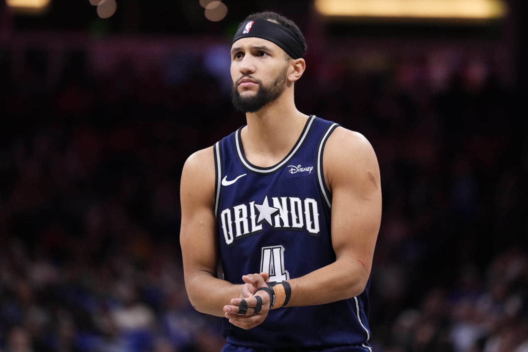 ORLANDO, FLORIDA - APRIL 07: Jalen Suggs #4 of the Orlando Magic looks on against the Chicago Bulls during the fourth quarter at Kia Center on April 07, 2024 in Orlando, Florida. NOTE TO USER: User expressly acknowledges and agrees that, by downloading and or using this photograph, User is consenting to the terms and conditions of the Getty Images License Agreement. (Photo by Rich Storry/Getty Images)