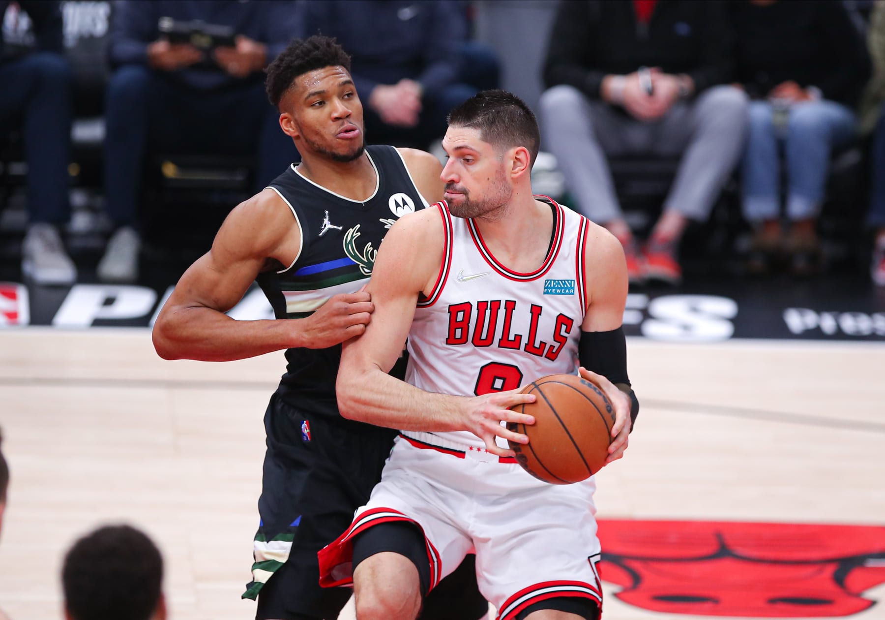 CHICAGO, IL - APRIL 22: Milwaukee Bucks forward Giannis Antetokounmpo (34) posts up against Chicago Bulls center Nikola Vucevic (9) during Game Three of the Eastern Conference First Round Playoffs between the Milwaukee  Bucks and the Chicago Bulls on April 22, 2022 at the United Center in Chicago, IL. (Photo by Melissa Tamez/Icon Sportswire via Getty Images)