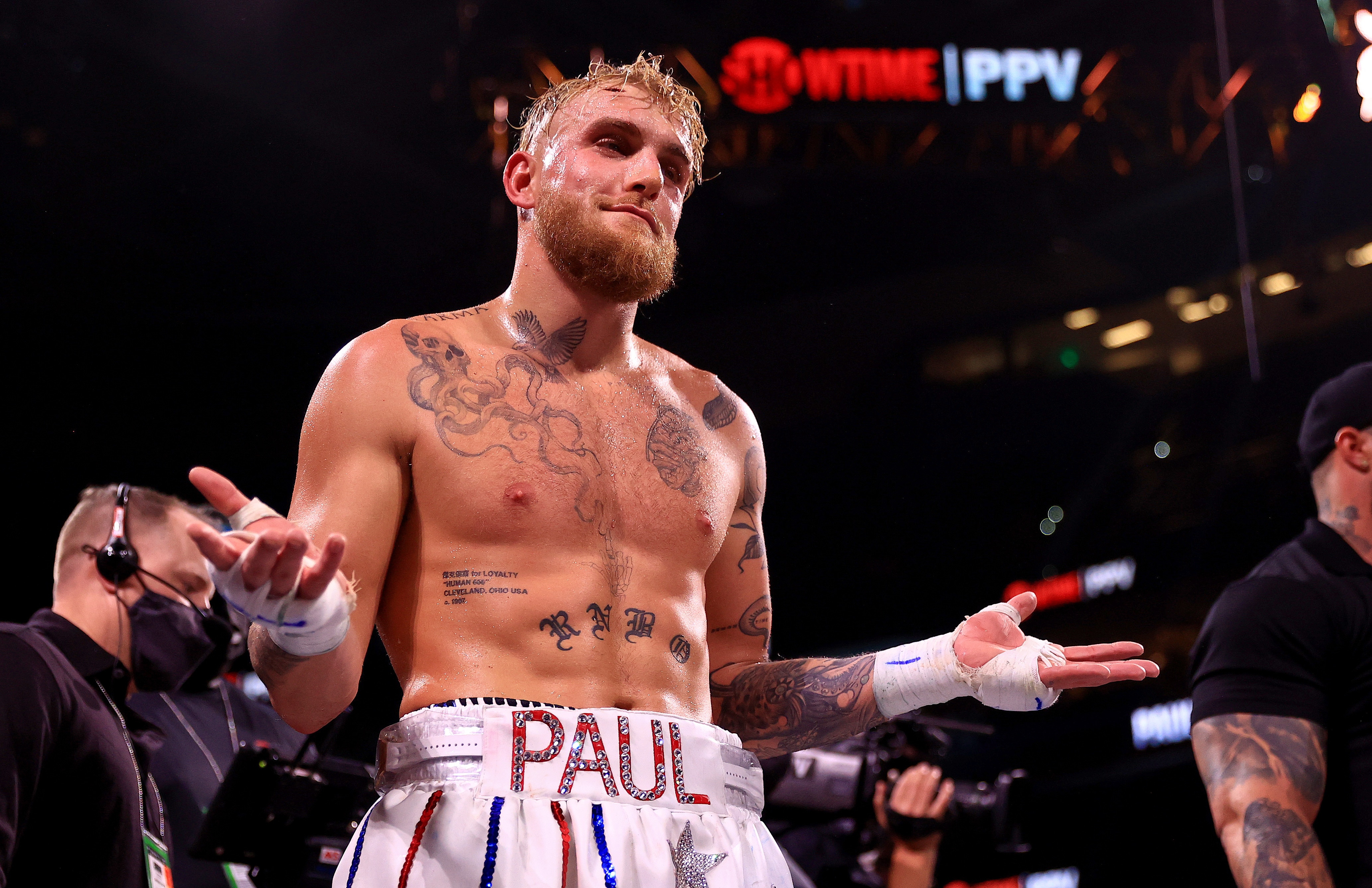 TAMPA, FLORIDA - DECEMBER 18:  Jake Paul reacts to knocking out Tyron Woddley in the sixth round during an eight-round cruiserweight bout at the Amalie Arena on December 18, 2021 in Tampa, Florida. (Photo by Mike Ehrmann/Getty Images)