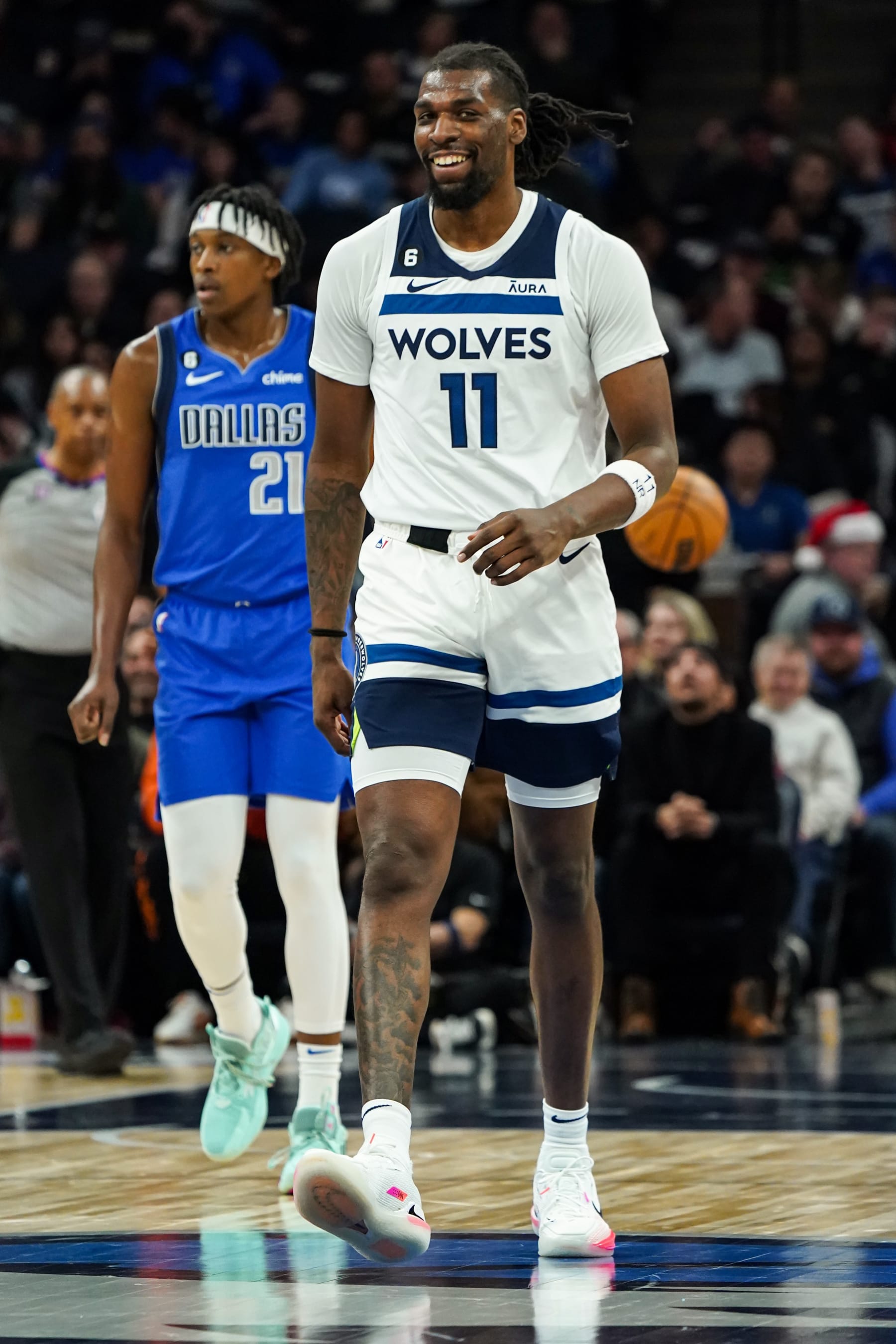 MINNEAPOLIS, MN -  DECEMBER 19: Naz Reid #11 of the Minnesota Timberwolves looks on during the game against the Dallas Mavericks on December 19, 2022 at Target Center in Minneapolis, Minnesota. NOTE TO USER: User expressly acknowledges and agrees that, by downloading and or using this Photograph, user is consenting to the terms and conditions of the Getty Images License Agreement. Mandatory Copyright Notice: Copyright 2022 NBAE (Photo by Jordan Johnson/NBAE via Getty Images)