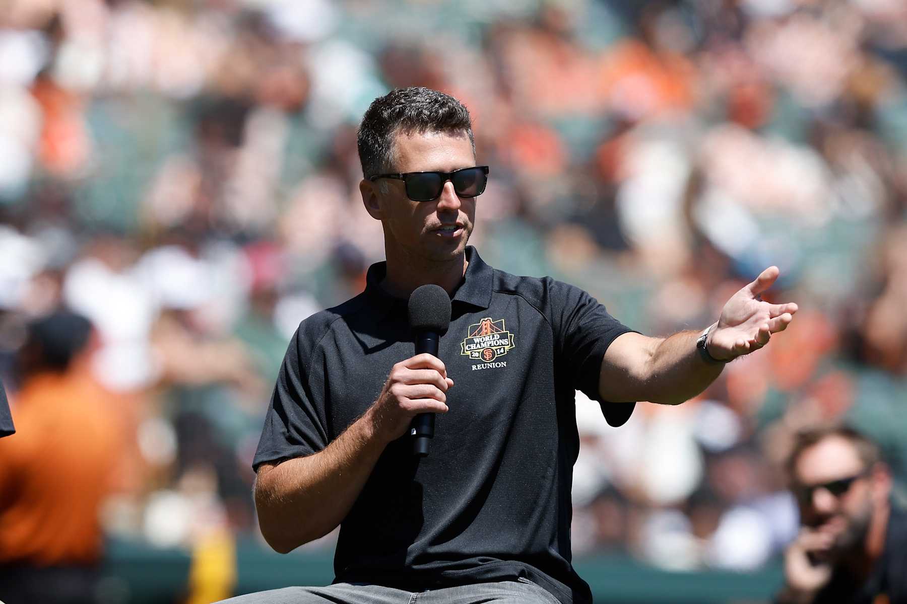 SAN FRANCISCO, CALIFORNIA - AUGUST 10: Former San Francisco Giants player Buster Posey addresses the crowd during the 2014 World Series Reunion ceremony before the game between the San Francisco Giants and the Detroit Tigers at Oracle Park on August 10, 2024 in San Francisco, California. (Photo by Lachlan Cunningham/Getty Images)