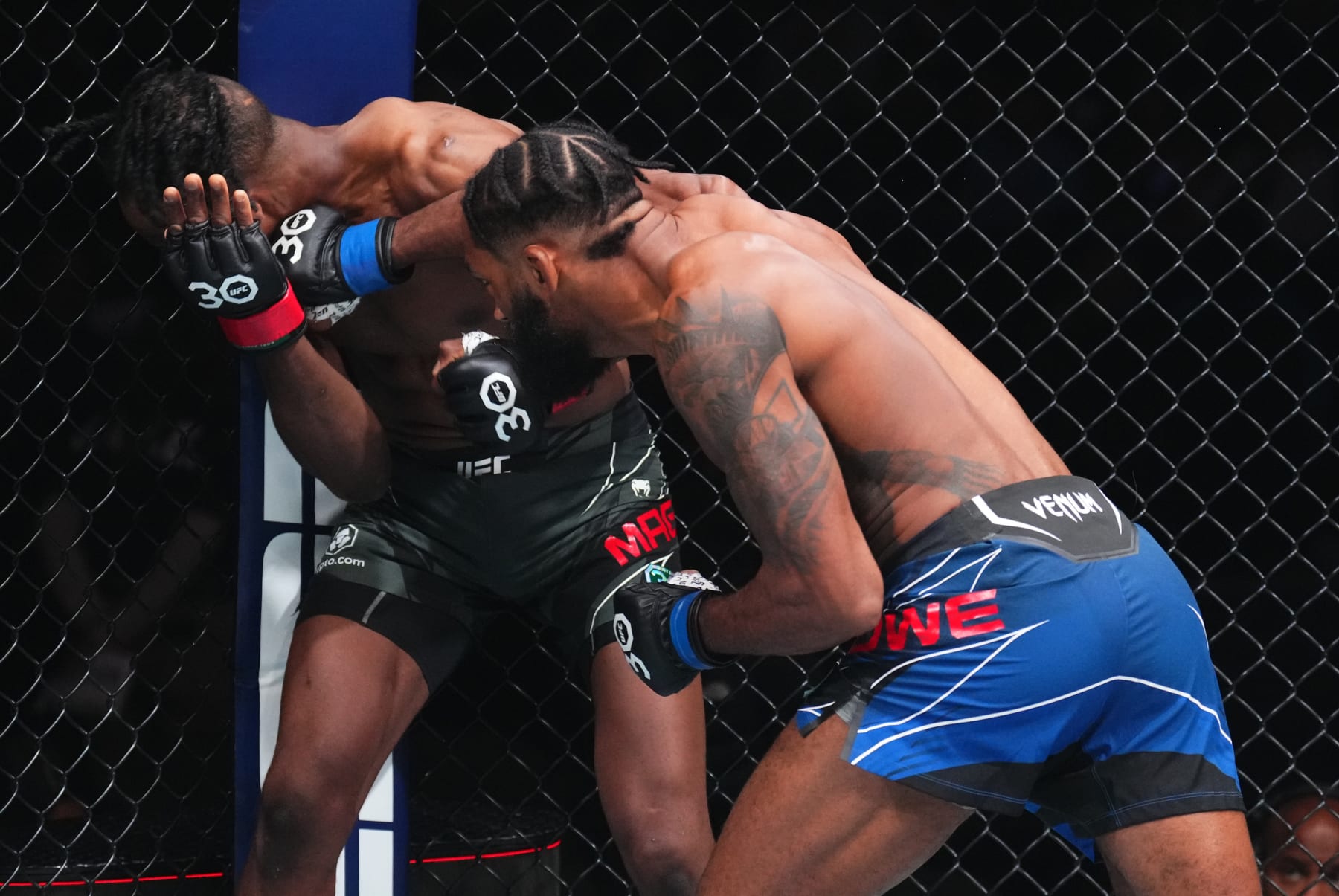 JACKSONVILLE, FLORIDA - JUNE 24:  (R-L) Phil Rowe punches Neil Magny in their welterweight fight during the UFC Fight Night event at Vystar Veterans Memorial Arena on June 24, 2023 in Jacksonville, Florida. (Photo by Josh Hedges/Zuffa LLC)