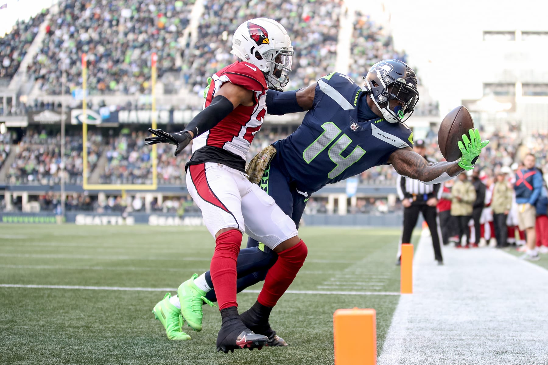 SEATTLE, WASHINGTON - NOVEMBER 21: DK Metcalf #14 of the Seattle Seahawks attempts to make a catch in front of Marco Wilson #20 of the Arizona Cardinals in the endzone but is unable to get both feet down during the second quarter at Lumen Field on November 21, 2021 in Seattle, Washington. (Photo by Steph Chambers/Getty Images)