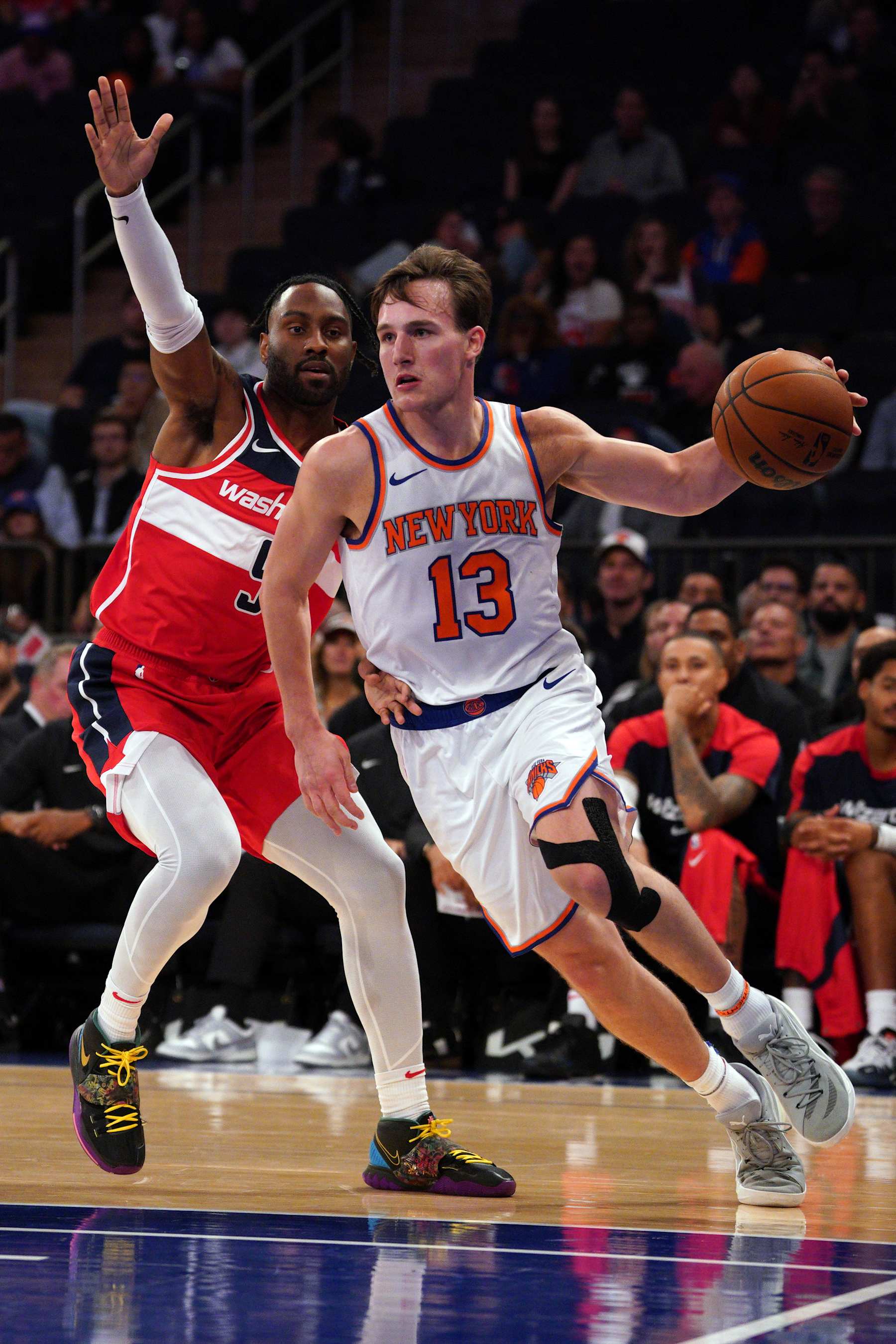 NEW YORK, NEW YORK - OCTOBER 09: Tyler Kolek #13 of the New York Knicks dribbles the ball against the Washington Wizards during the second half of a preseason game at Madison Square Garden on October 09, 2024 in New York City. NOTE TO USER: User expressly acknowledges and agrees that, by downloading and or using this Photograph, user is consenting to the terms and conditions of the Getty Images License Agreement. (Photo by Evan Bernstein/Getty Images)