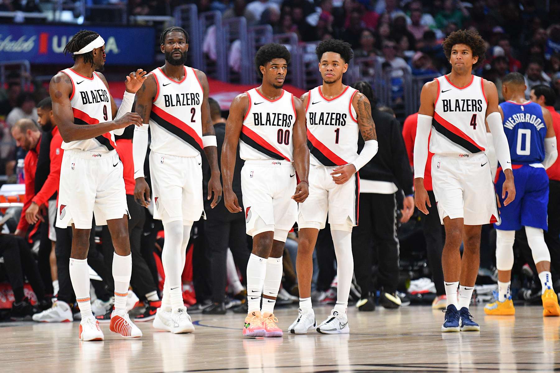 LOS ANGELES, CA - OCTOBER 25: Portland Trail Blazers forward Jerami Grant (9), Portland Trail Blazers center DeAndre Ayton (2), Portland Trail Blazers guard Scoot Henderson (00), Portland Trail Blazers guard Anfernee Simons (1) and Portland Trail Blazers forward Matisse Thybulle (4) look on during a NBA  game between the Denver Nuggets and the Portland Trail Blazers on October 25, 2023 at Crypto.com Arena in Los Angeles, CA. (Photo by Brian Rothmuller/Icon Sportswire via Getty Images)