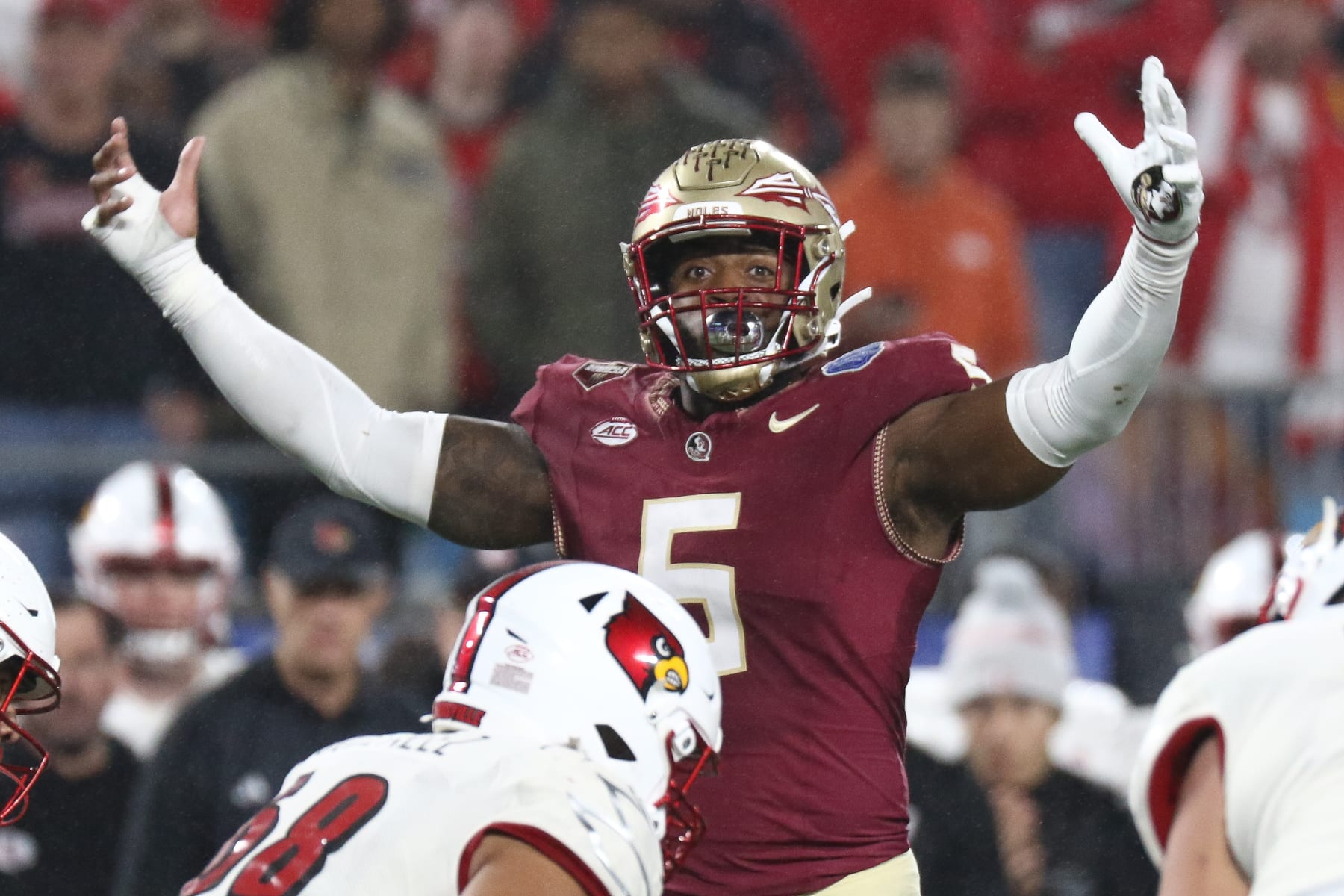 CHARLOTTE, NORTH CAROLINA - DECEMBER 2: Jared Verse #5 of the Florida State Seminoles hypes the crowd late in the fourth quarter against the Louisville Cardinals during the ACC Championship at Bank of America Stadium on December 2, 2023 in Charlotte, North Carolina. (Photo by Isaiah Vazquez/Getty Images)