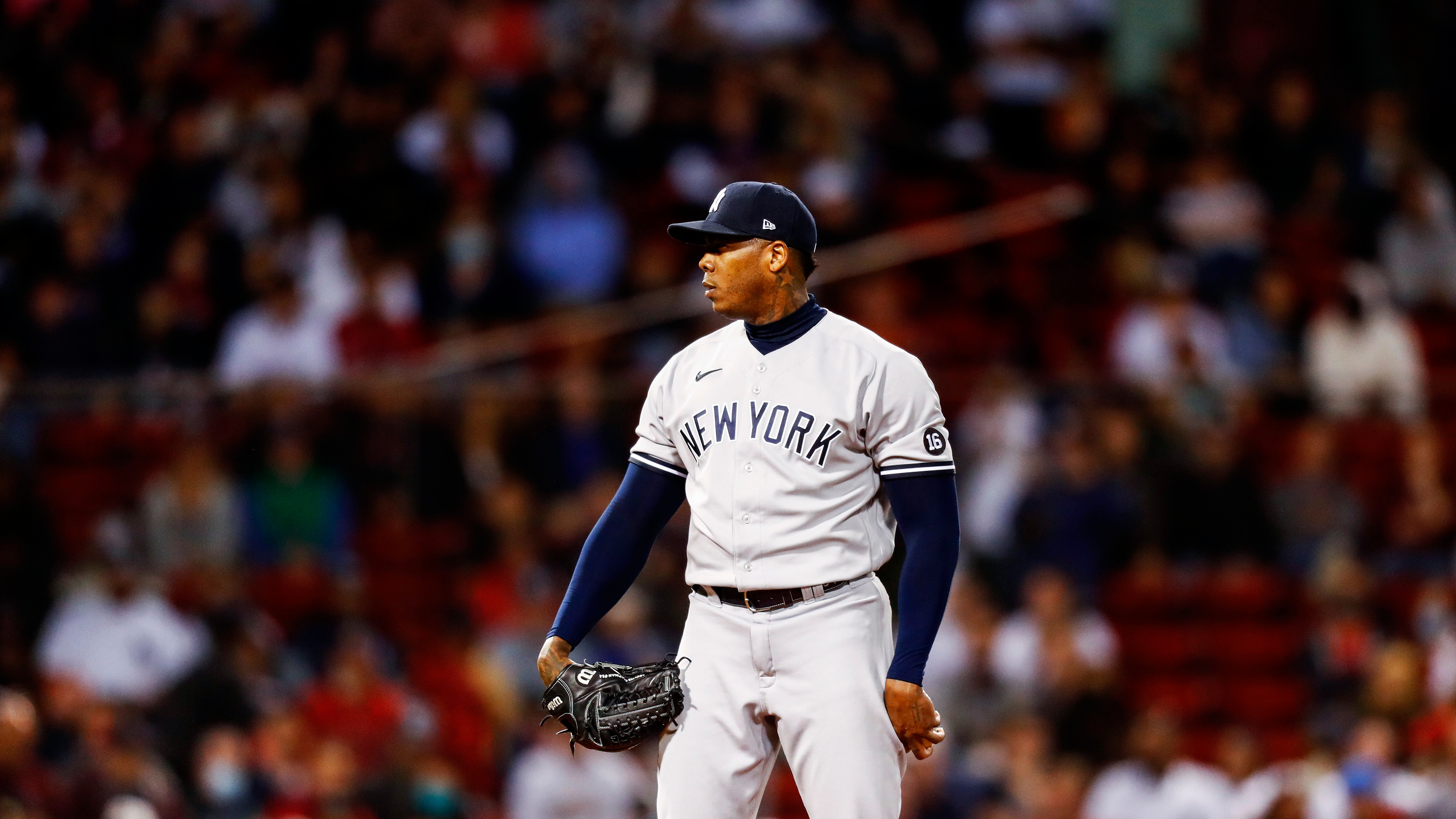 BOSTON, MASSACHUSETTS - SEPTEMBER 26: Relief pitcher Aroldis Chapman #54 of the New York Yankees looks on before pitching in the bottom ninth inning of the game against the Boston Red Sox at Fenway Park on September 26, 2021 in Boston, Massachusetts. (Photo by Omar Rawlings/Getty Images)