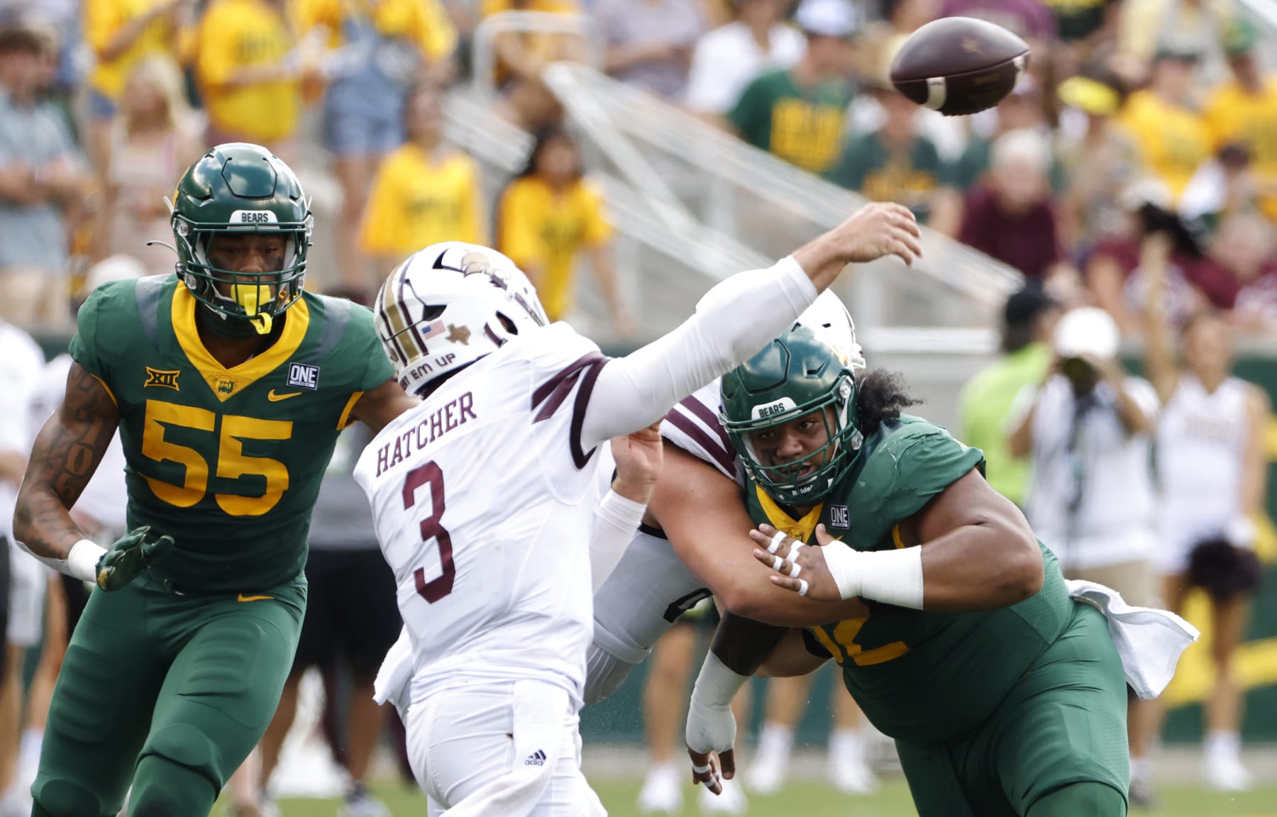 WACO, TX - SEPTEMBER 17: Siaki Ika #62 of the Baylor Bears and teammate Garmon Randolph #55 pressure Layne Hatcher #3 of the Texas State Bobcats in the first half at McLane Stadium on September 17, 2022 in Waco, Texas. (Photo by Ron Jenkins/Getty Images)