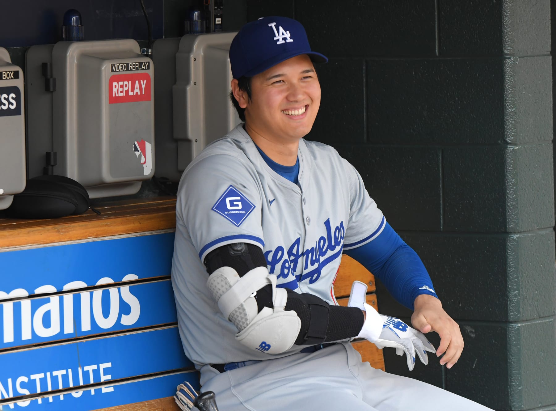 DETROIT, MI - JULY 13:  Shohei Ohtani #17 of the Los Angeles Dodgers looks on from the dugout and smiles just before the start of the game against the Detroit Tigers at Comerica Park on July 13, 2024 in Detroit, Michigan. Ohtani hit his 200th career MLB home run in the 5th inning. The Tigers defeated the Dodgers 11-9 in 10 innings.  (Photo by Mark Cunningham/MLB Photos via Getty Images)