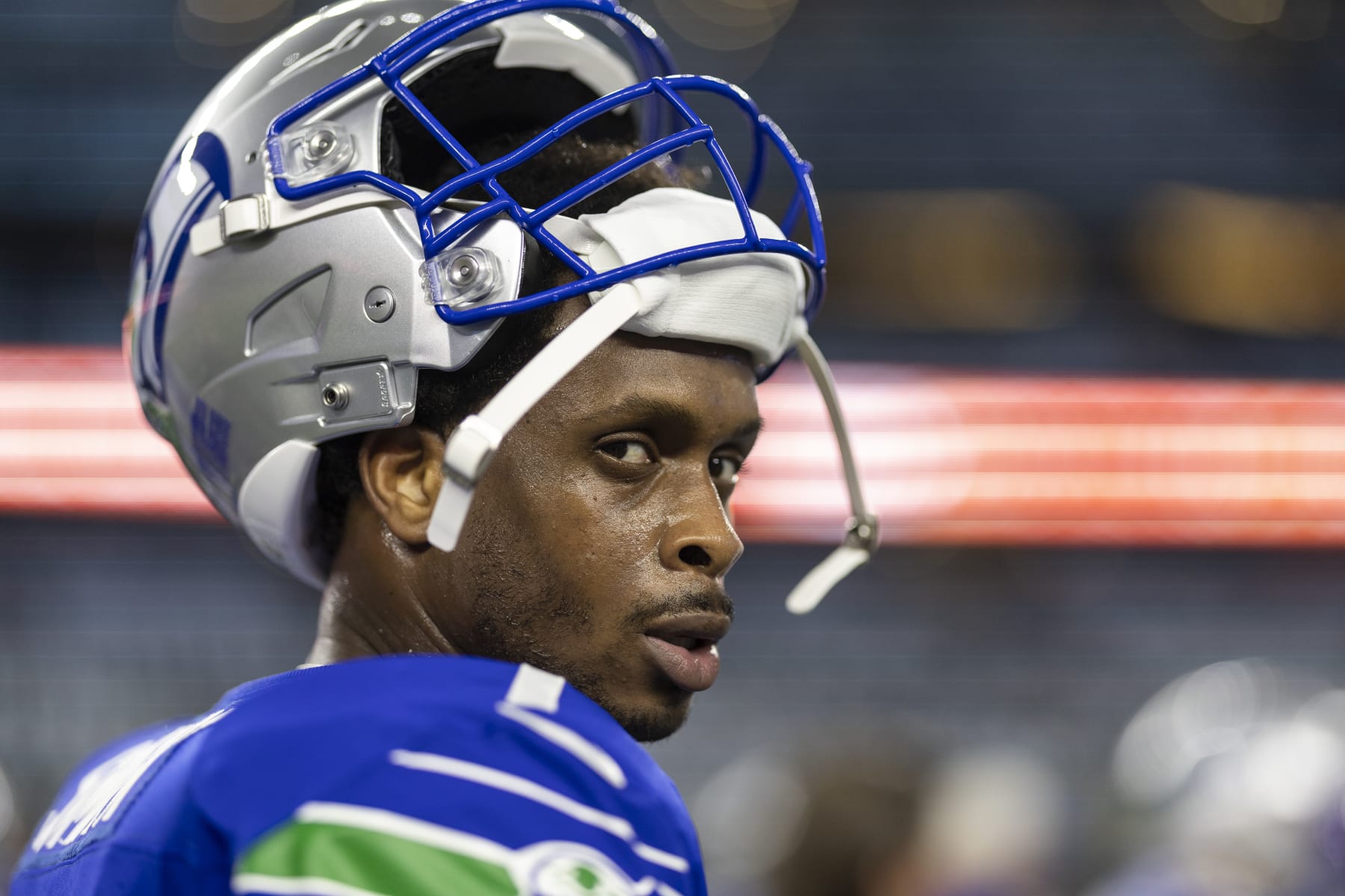 ARLINGTON, TEXAS - NOVEMBER 30: Geno Smith #7 of the Seattle Seahawks looks on with his helmet off prior to an NFL football game between the Dallas Cowboys and the Seattle Seahawks at AT&T Stadium on November 30, 2023 in Arlington, Texas. (Photo by Michael Owens/Getty Images)