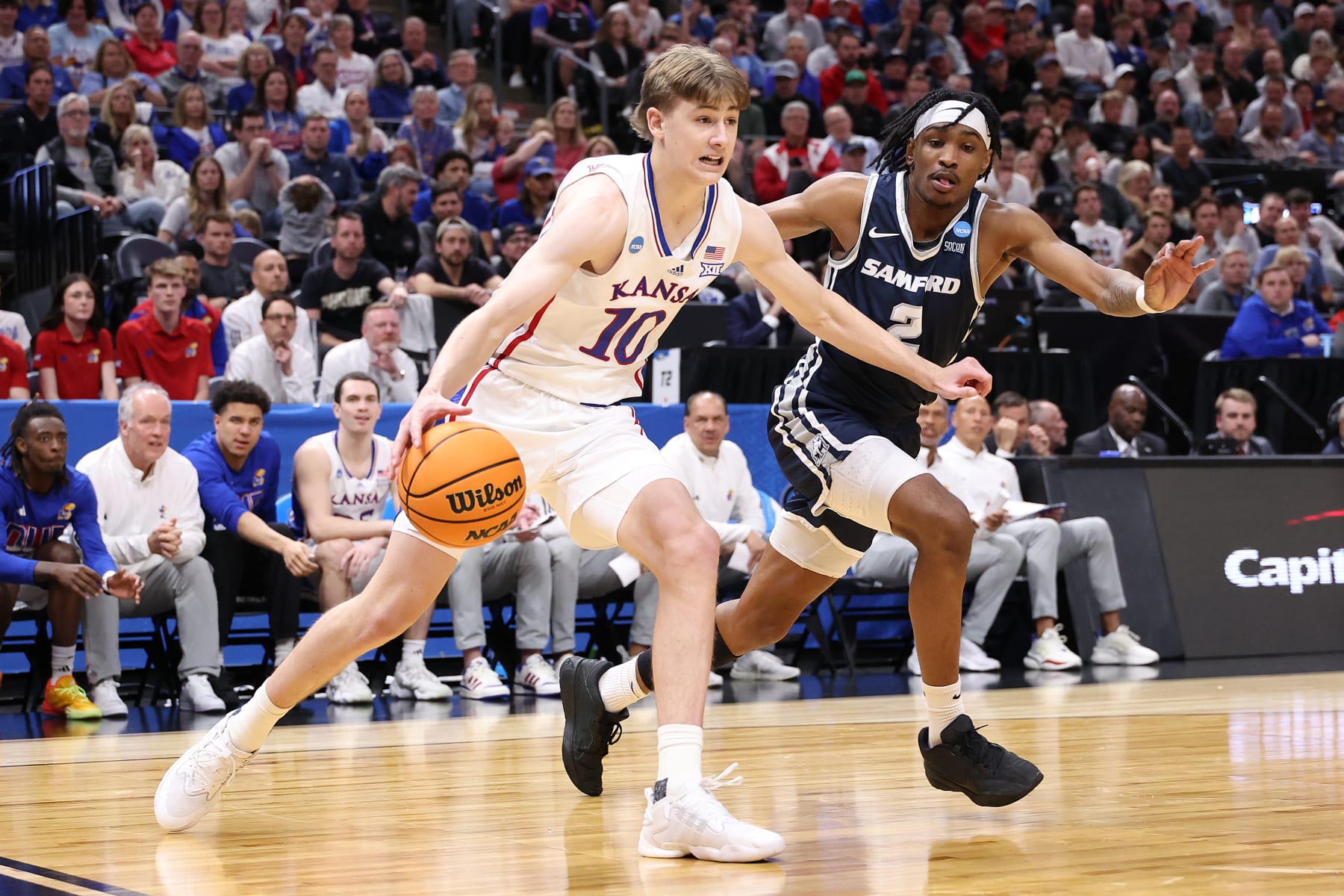 SALT LAKE CITY, UTAH - MARCH 21:  Johnny Furphy #10 of the Kansas Jayhawks is defended by Jaden Campbell #2 of the Samford Bulldogs during the second half in the first round of the NCAA Men's Basketball Tournament at Delta Center on March 21, 2024 in Salt Lake City, Utah. (Photo by Christian Petersen/Getty Images)