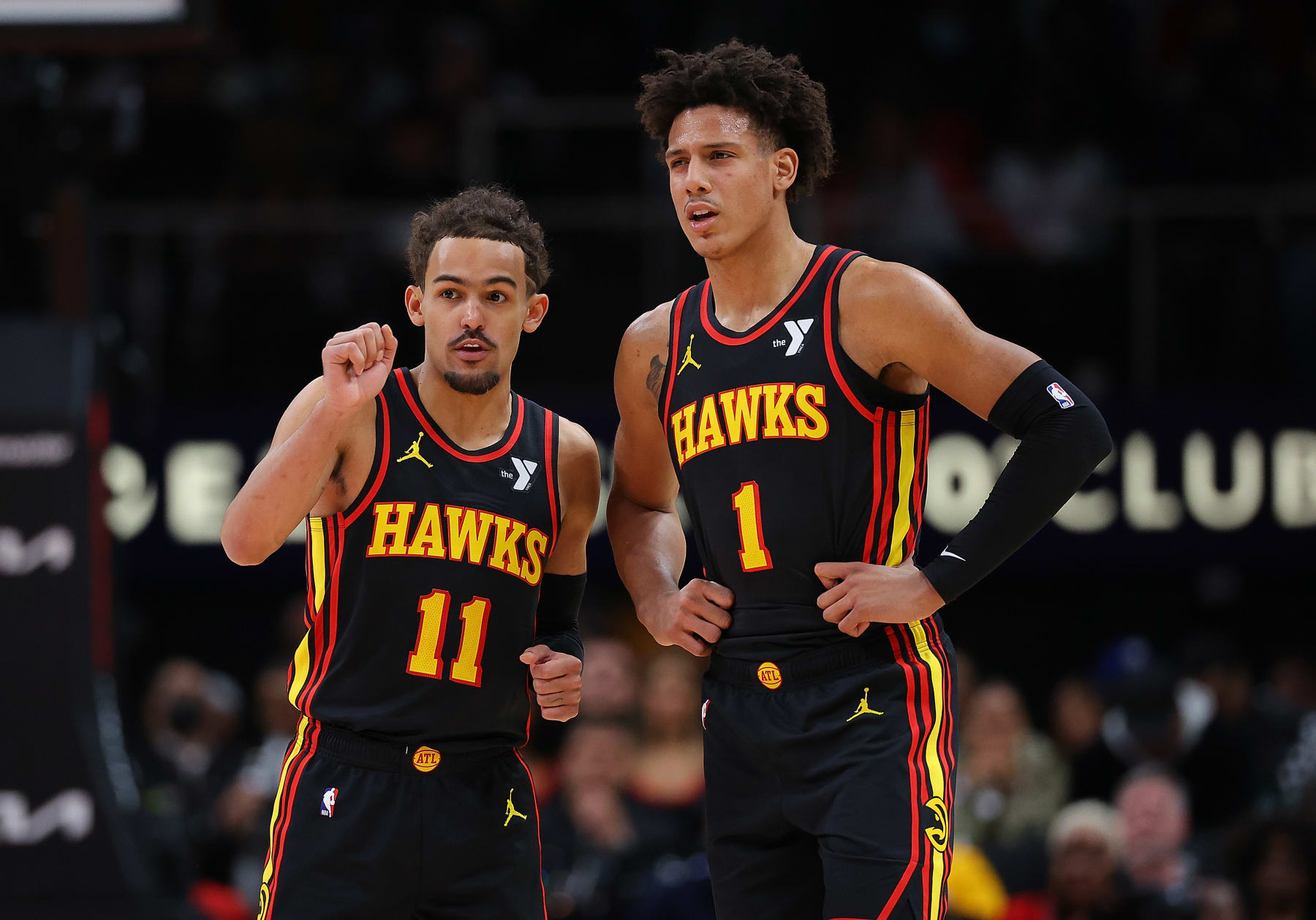 ATLANTA, GEORGIA - FEBRUARY 05:  Trae Young #11 and Jalen Johnson #1 of the Atlanta Hawks converse against the LA Clippers during the second quarter at State Farm Arena on February 05, 2024 in Atlanta, Georgia.  NOTE TO USER: User expressly acknowledges and agrees that, by downloading and/or using this photograph, user is consenting to the terms and conditions of the Getty Images License Agreement.  (Photo by Kevin C. Cox/Getty Images)