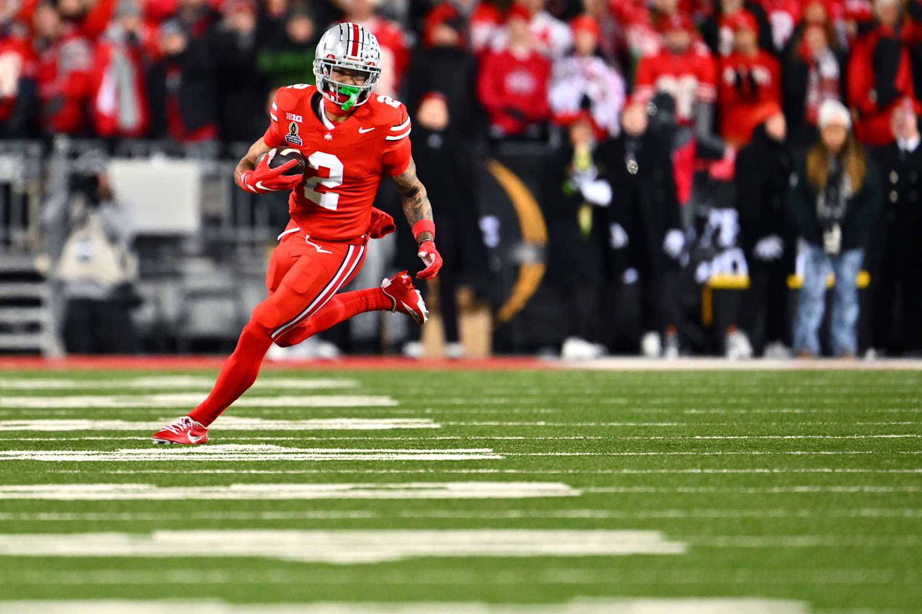 COLUMBUS, OHIO - DECEMBER 21: Emeka Egbuka #2 of the Ohio State Buckeyes runs with the ball during the second quarter against the Tennessee Volunteers in the Playoff First Round Game at Ohio Stadium on December 21, 2024 in Columbus, Ohio.  (Photo by Jason Miller/Getty Images)