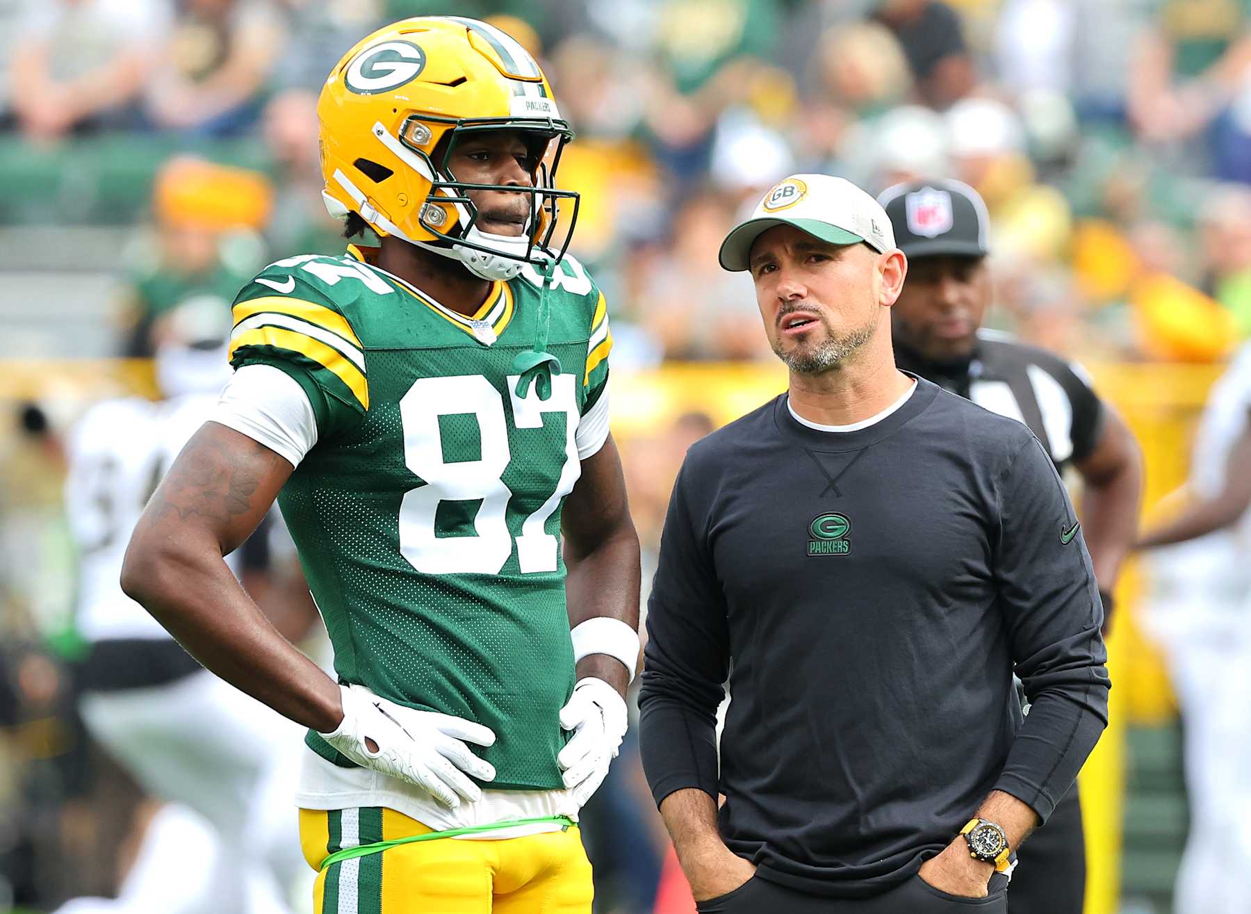 GREEN BAY, WISCONSIN - SEPTEMBER 24: Head coach Matt LaFleur of the Green Bay Packers talks to Romeo Doubs #87 of the Green Bay Packers prior to a game against the New Orleans Saints at Lambeau Field on September 24, 2023 in Green Bay, Wisconsin. (Photo by Stacy Revere/Getty Images)