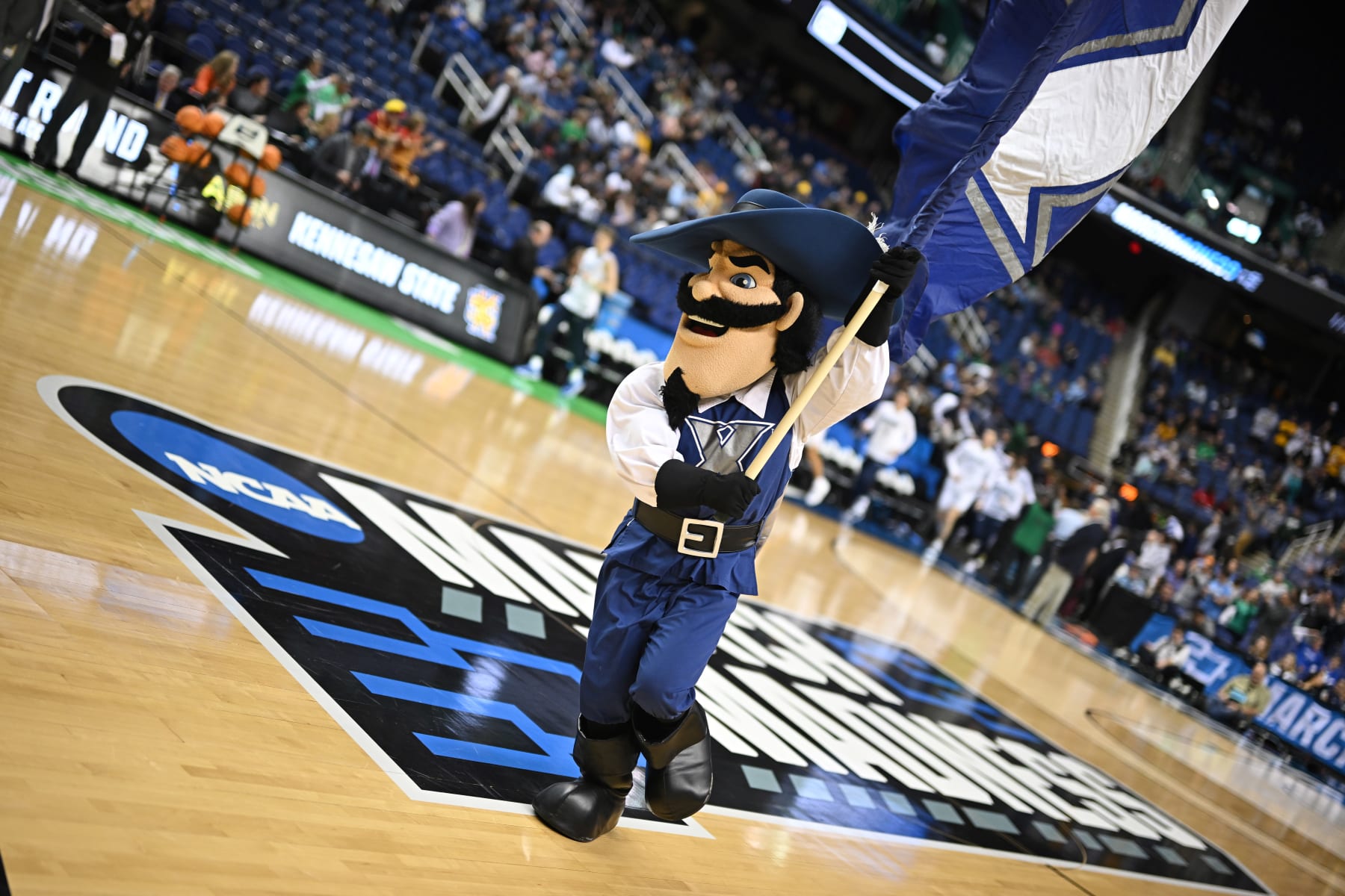 GREENSBORO, NC - MARCH 17: The Xavier Musketeers mascot leads the team onto the field before taking on the Kennesaw State Owls during the first round of the 2023 NCAA Men's Basketball Tournament held at Greensboro Coliseum on March 17, 2023 in Greensboro, North Carolina. (Photo by John Joyner/NCAA Photos via Getty Images)