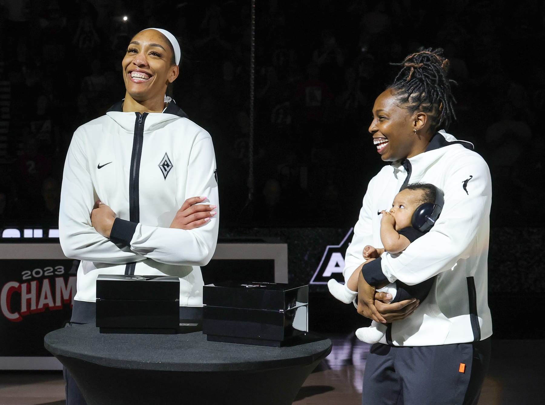LAS VEGAS, NEVADA - MAY 14: A'ja Wilson (L) #22 of the Las Vegas Aces and Chelsea Gray #12, holding Lennox Gray, are introduced during a championship ring presentation and banner-raising ceremony for the 2023 WNBA championship before the Aces' home opener against the Phoenix Mercury on May 14, 2024 in Las Vegas, Nevada. NOTE TO USER: User expressly acknowledges and agrees that, by downloading and or using this photograph, User is consenting to the terms and conditions of the Getty Images License Agreement. (Photo by Ethan Miller/Getty Images)