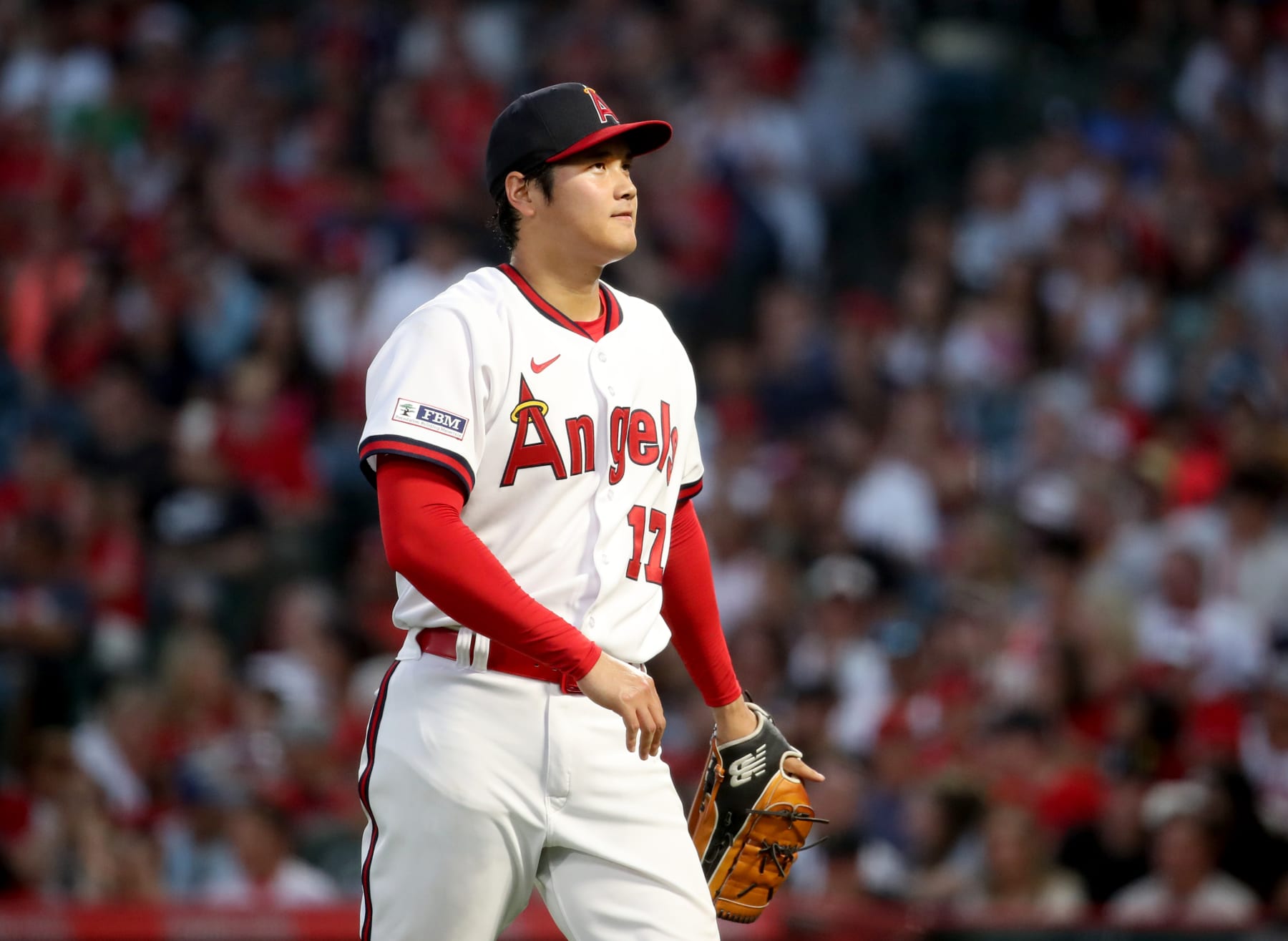 Anaheim, CA - July 21: Evening sunlight illuminates Angels starting pitcher and two-way player Shohei Ohtani as he  pitches in the third inning against the Pirates at Angel Stadium in Anaheim Friday, July 21, 2023.  (Allen J. Schaben / Los Angeles Times via Getty Images)