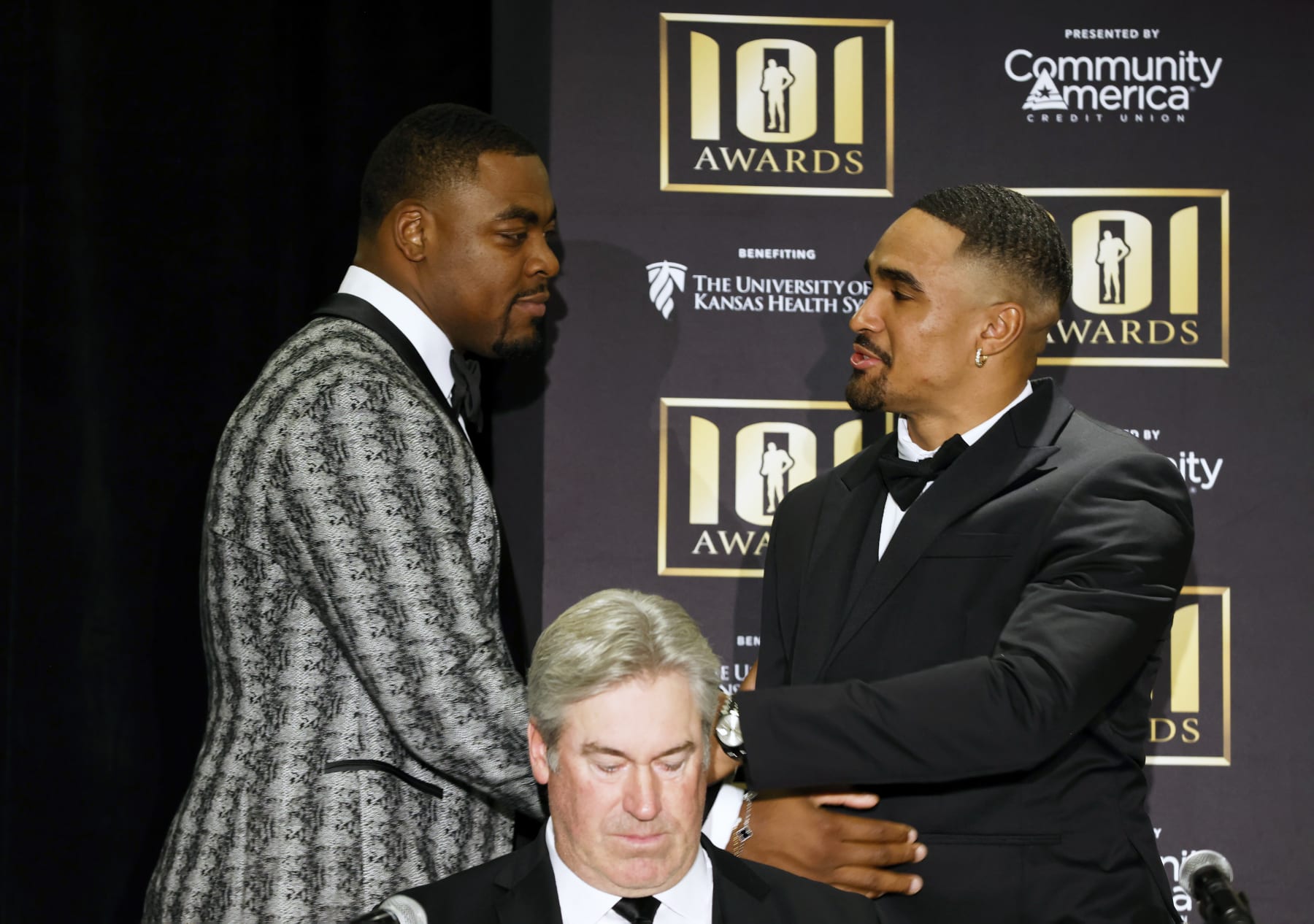 AFC Defensive Player of the Year winner Chris Jones, left, of the Kansas City Chiefs, and NFC offensive Player of the Year award winner Jalen Hurts, right, of the Philadelphia Eagles, greet each other during an NFL football news conference prior to the annual 101 Awards gala Saturday, Feb. 25, 2023, in Kansas City, Mo. (AP Photo/Colin E. Braley)