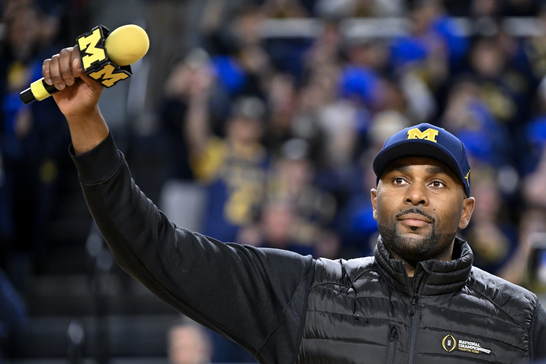 ANN ARBOR, MICHIGAN - JANUARY 27: Michigan Wolverines head football coach Sherrone Moore speaks during a timeout in the first half of a game against the Iowa Hawkeyes at Crisler Arena on January 27, 2024 in Ann Arbor, Michigan. (Photo by Luke Hales/Getty Images) ANN ARBOR, MICHIGAN - JANUARY 27: Michigan Wolverines head football coach Sherrone Moore speaks during a timeout in the first half of a game against the Iowa Hawkeyes at Crisler Arena on January 27, 2024 in Ann Arbor, Michigan. (Photo by Luke Hales/Getty Images)